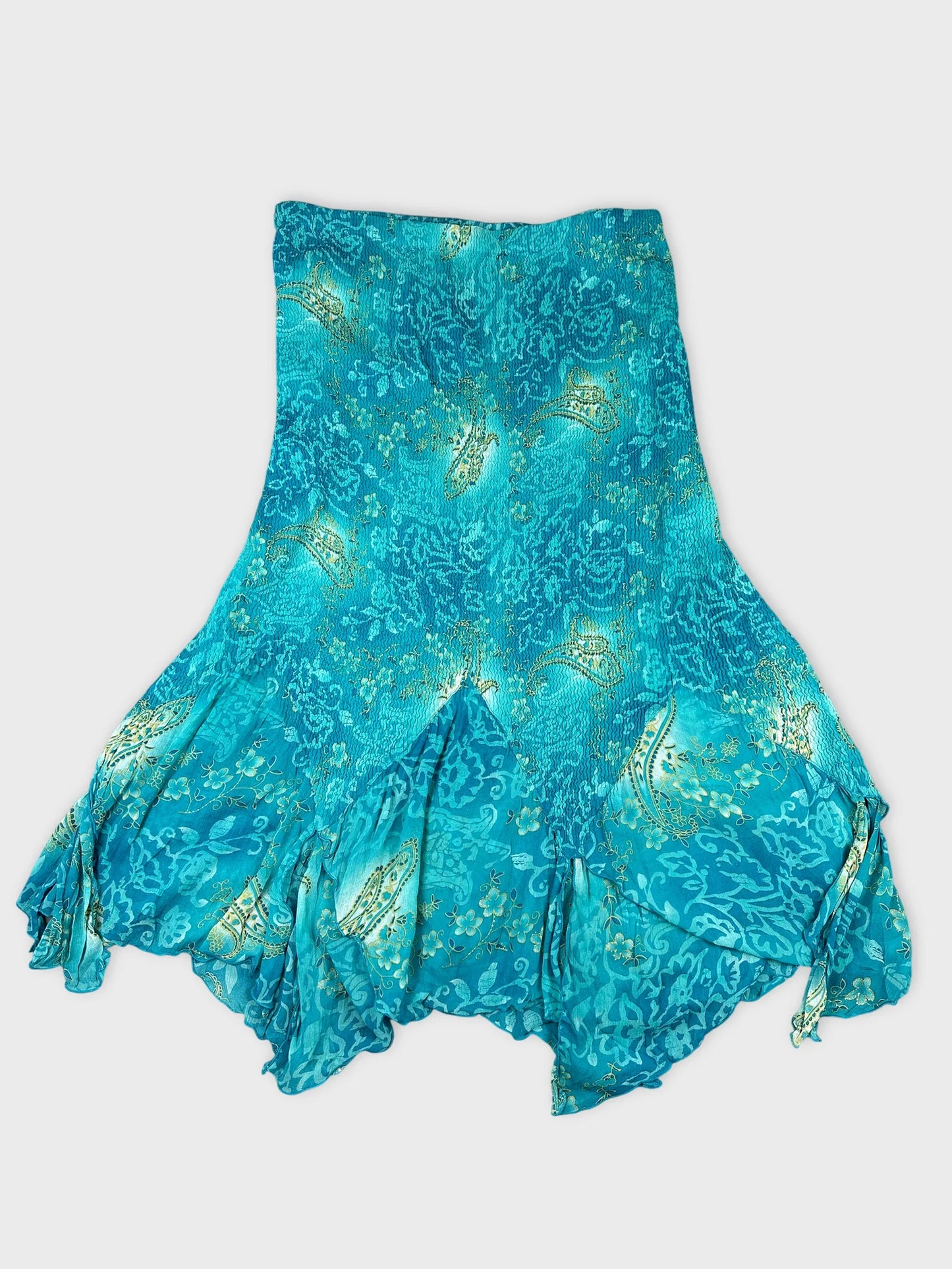 Front view of a vintage turquoise bottom dress with ruffled hem and floral patterns.