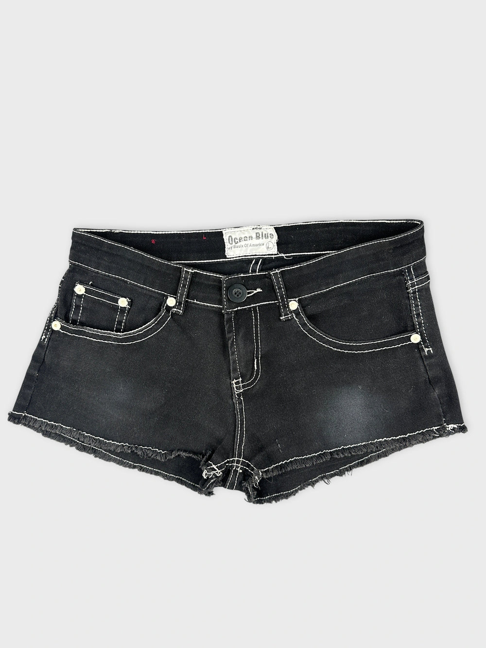 Front view of black mini shorts featuring frayed hem and white stitching.