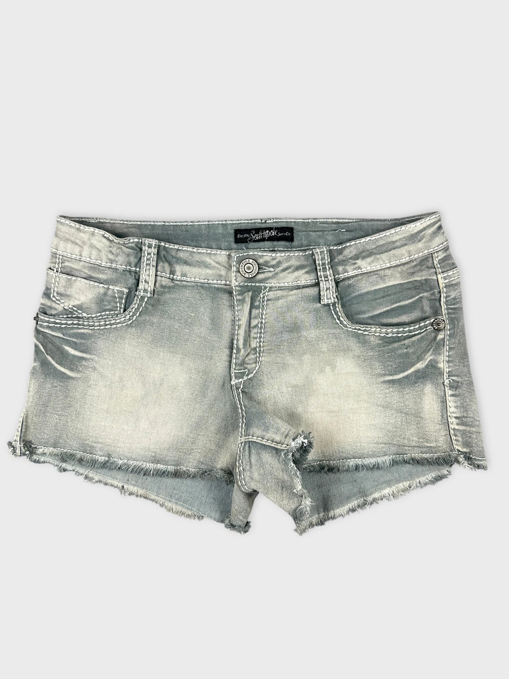 Front view of grey denim shorts featuring distressed hem and classic pockets.