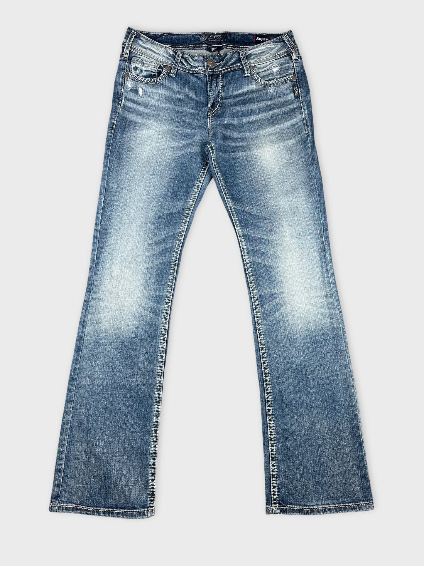 Front view of blue jeans featuring a faded wash and straight leg design.