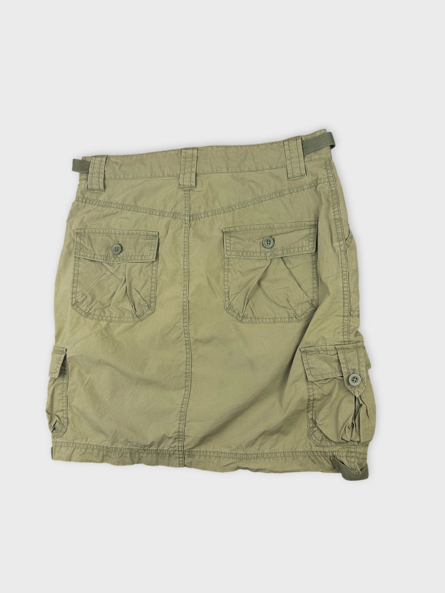 detail view of a khaki mini skirt with buttoned pockets