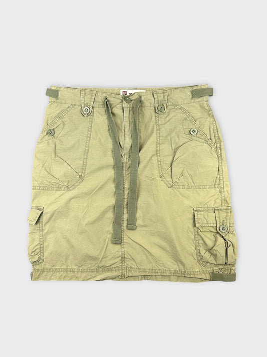 Front view of a green mini skirt featuring cargo pockets and drawstring detailing.