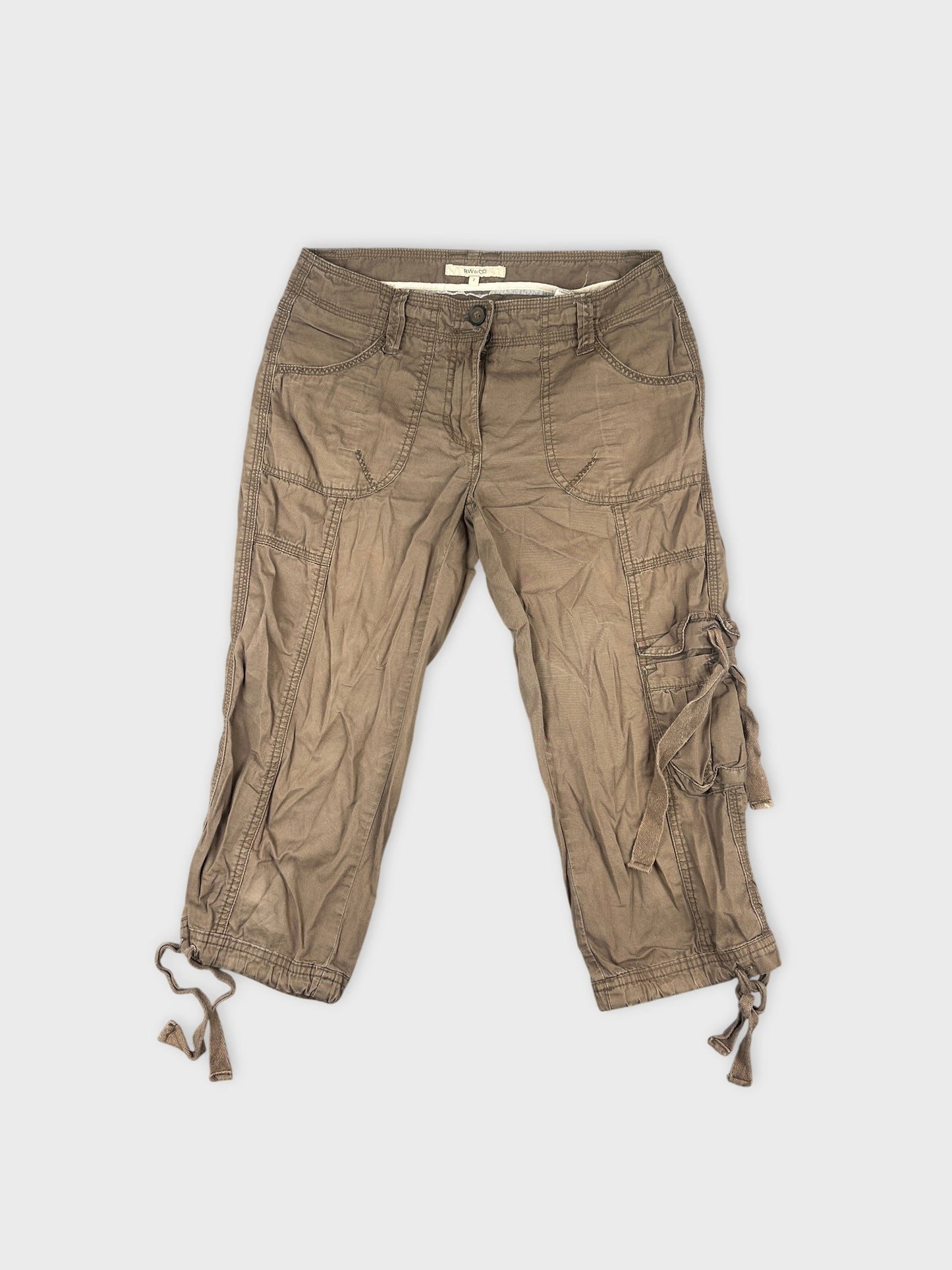 Front view of brown cargo shorts with tied detail and pockets.
