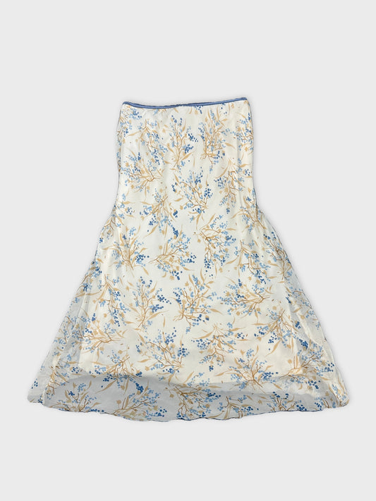 Back view of a floral print skirt in cream and blue.
