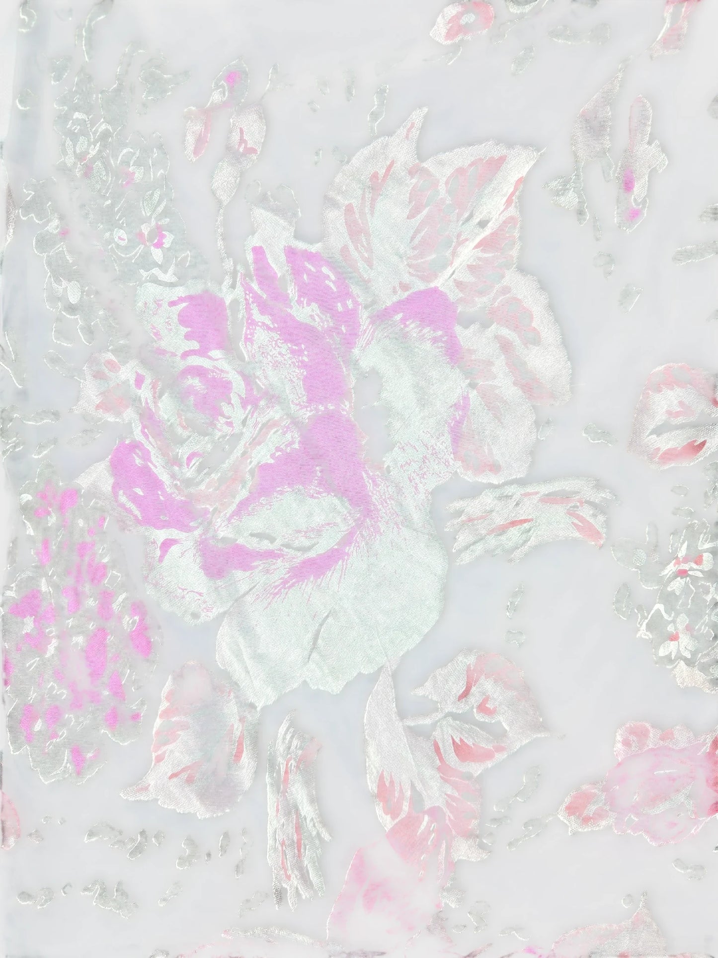 Detail view of a vintage skirt featuring a floral pattern in pink and silver.