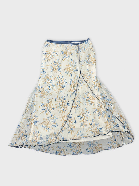 Front view of a floral print skirt in cream and blue colors.