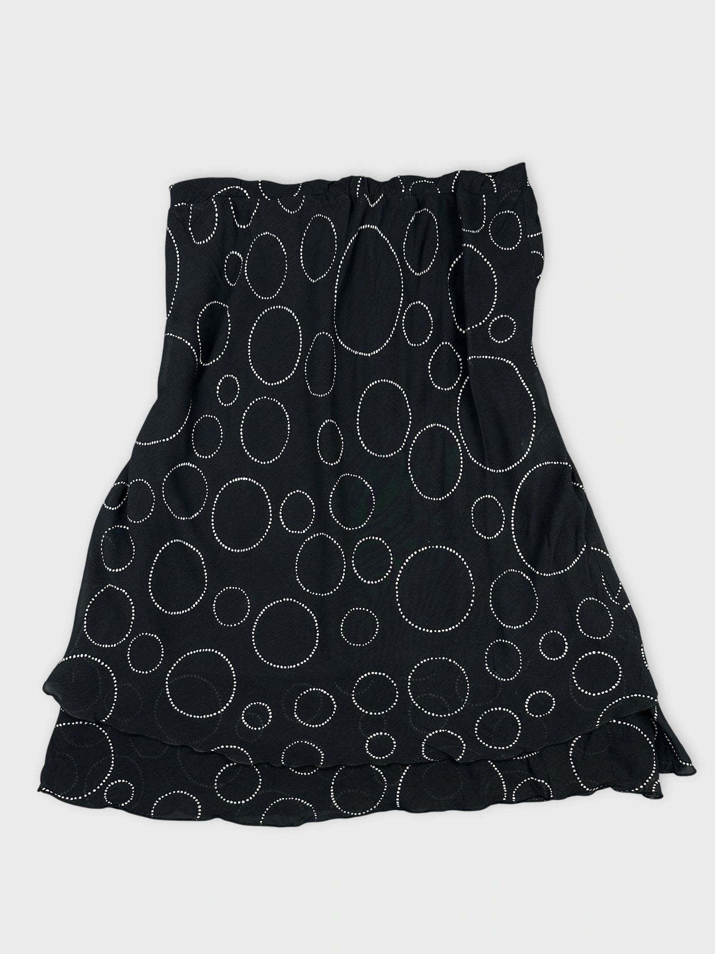 Black skirt with white polka dot pattern in front view