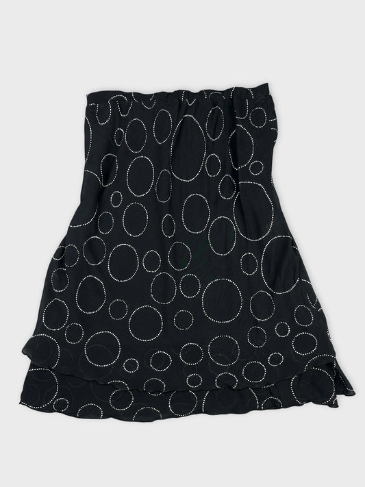 Black skirt with white polka dot pattern in front view