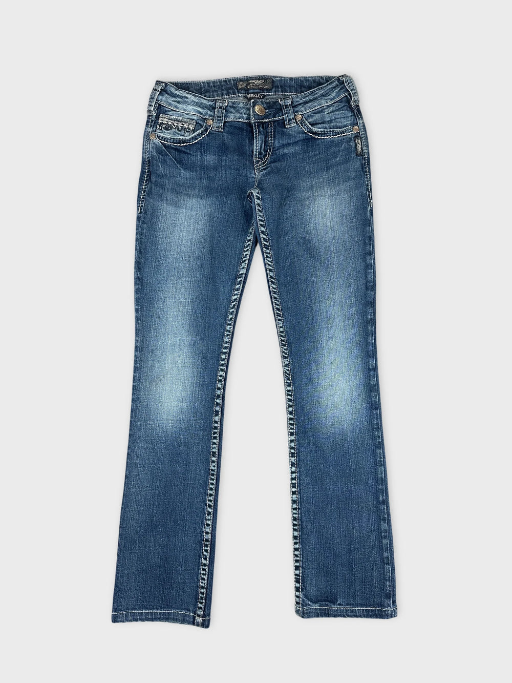 Front view of blue denim jeans with stitched trim detailing.