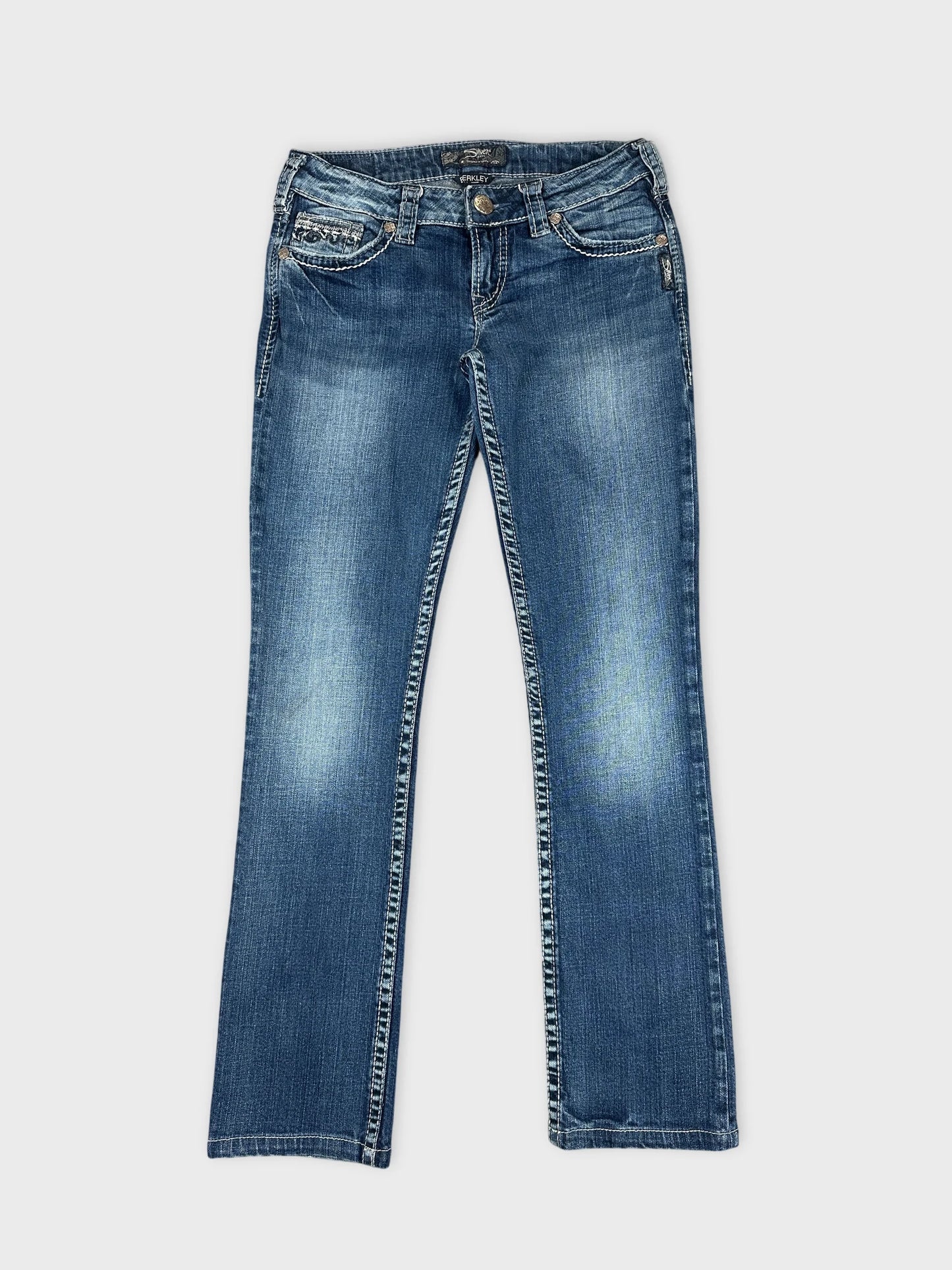 Front view of blue denim jeans with stitched trim detailing.