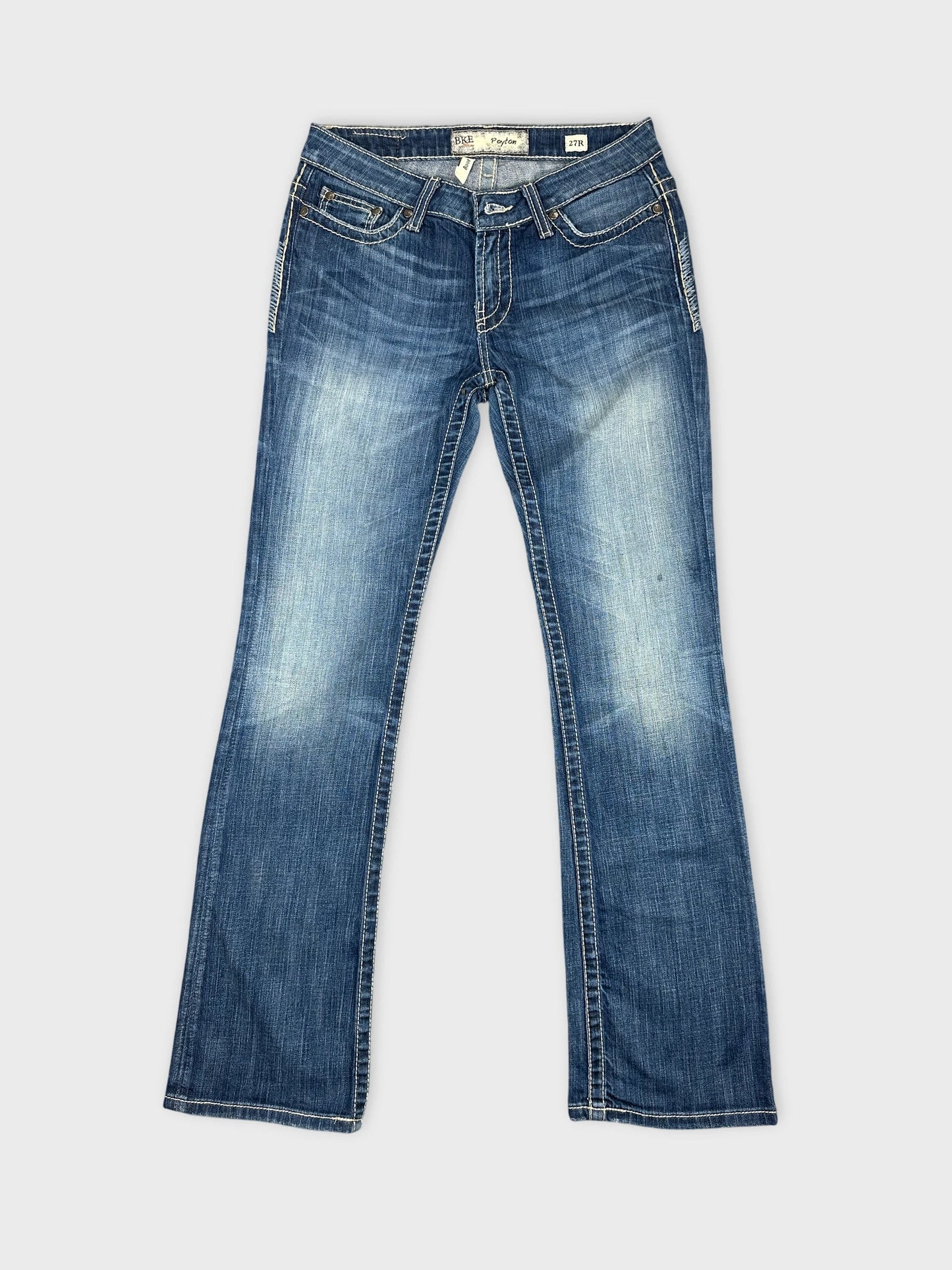 Front view of women denim jeans in dark blue with light fading.