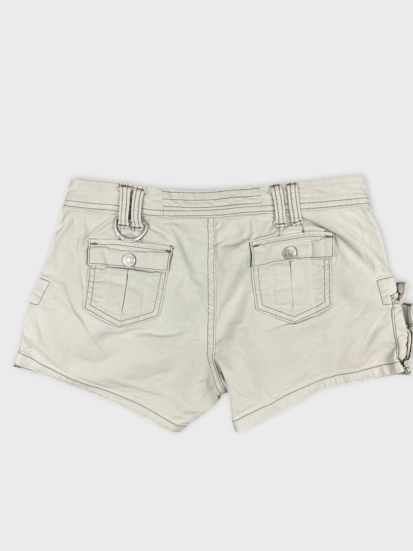 Back view of beige denim shorts featuring two back pockets.