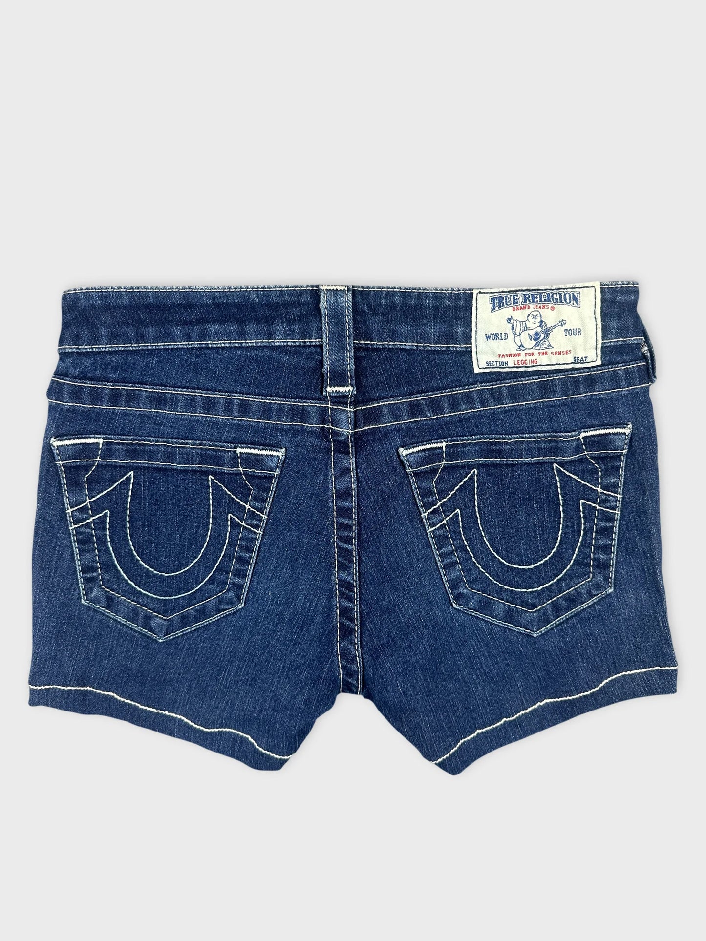 Back view of denim shorts with contrasting stitching and decorative pockets.
