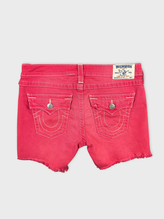 Back view of pink denim shorts featuring decorative stitching on pockets.