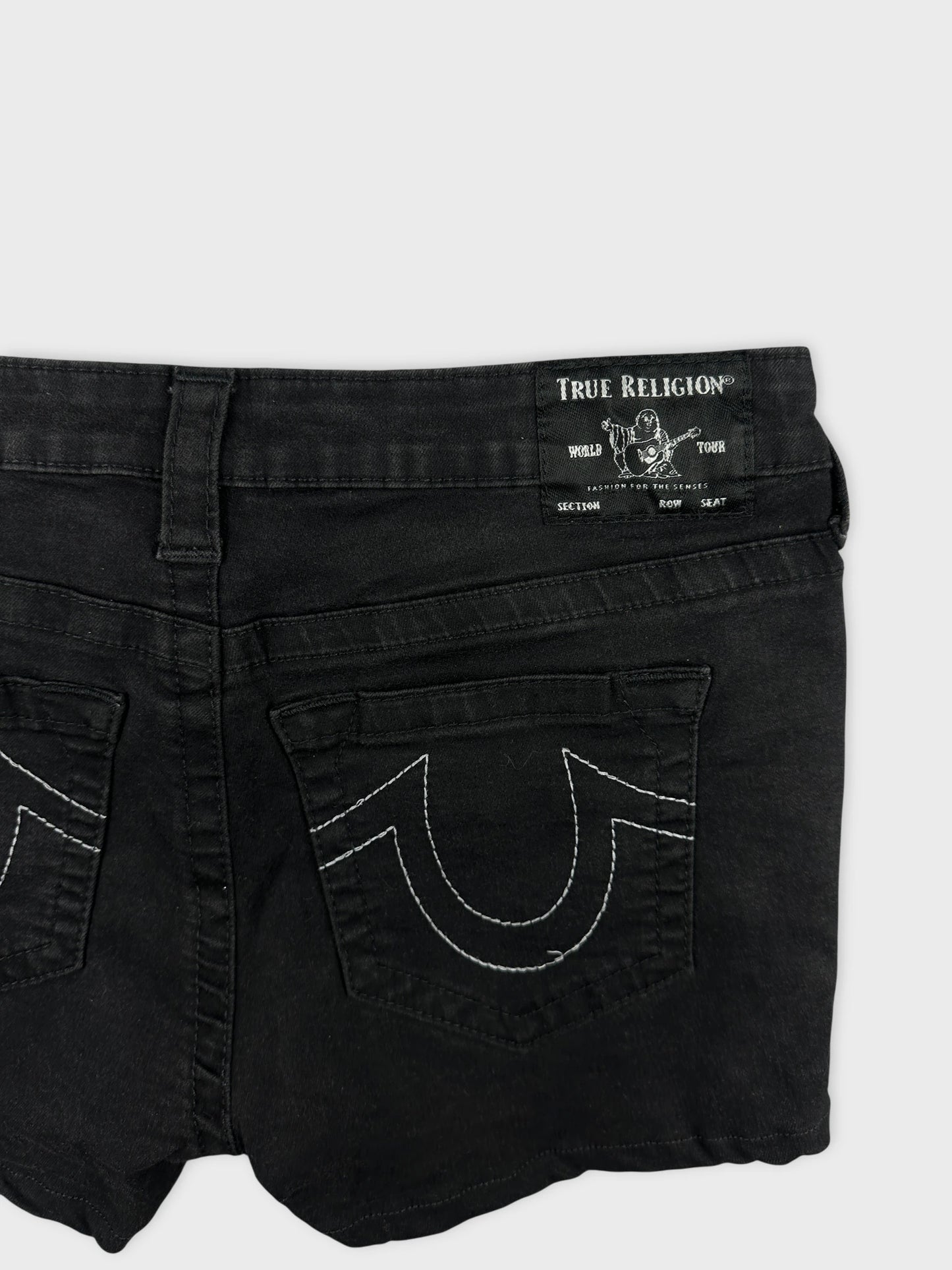 Black denim shorts with white stitching detail view