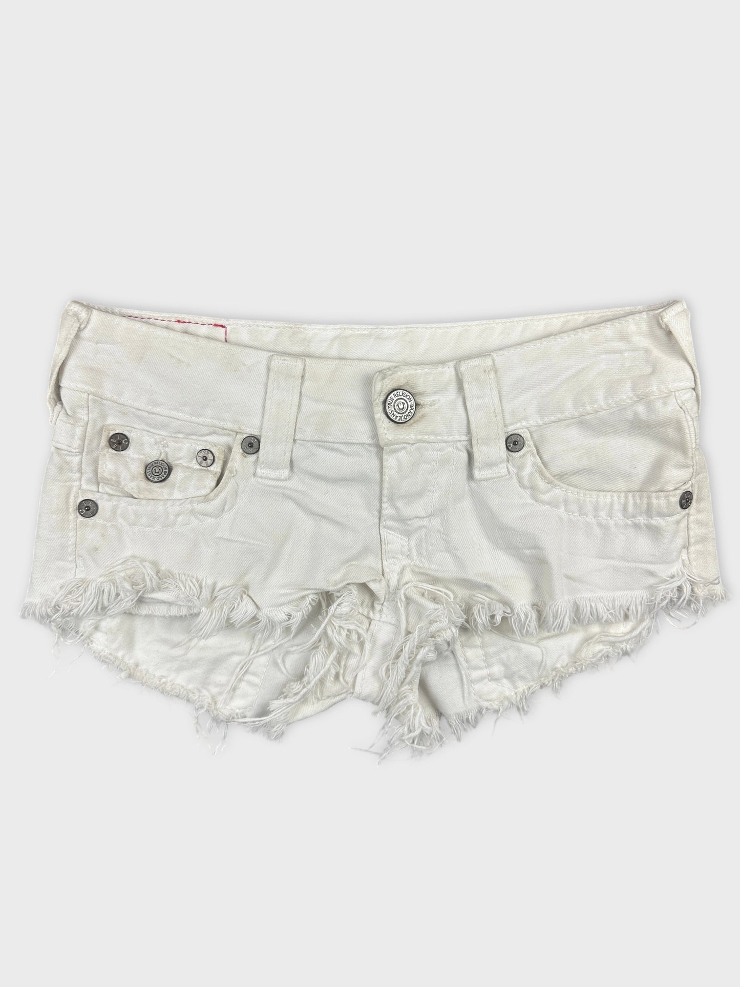 Front view of white denim shorts featuring frayed hems and two front pockets.