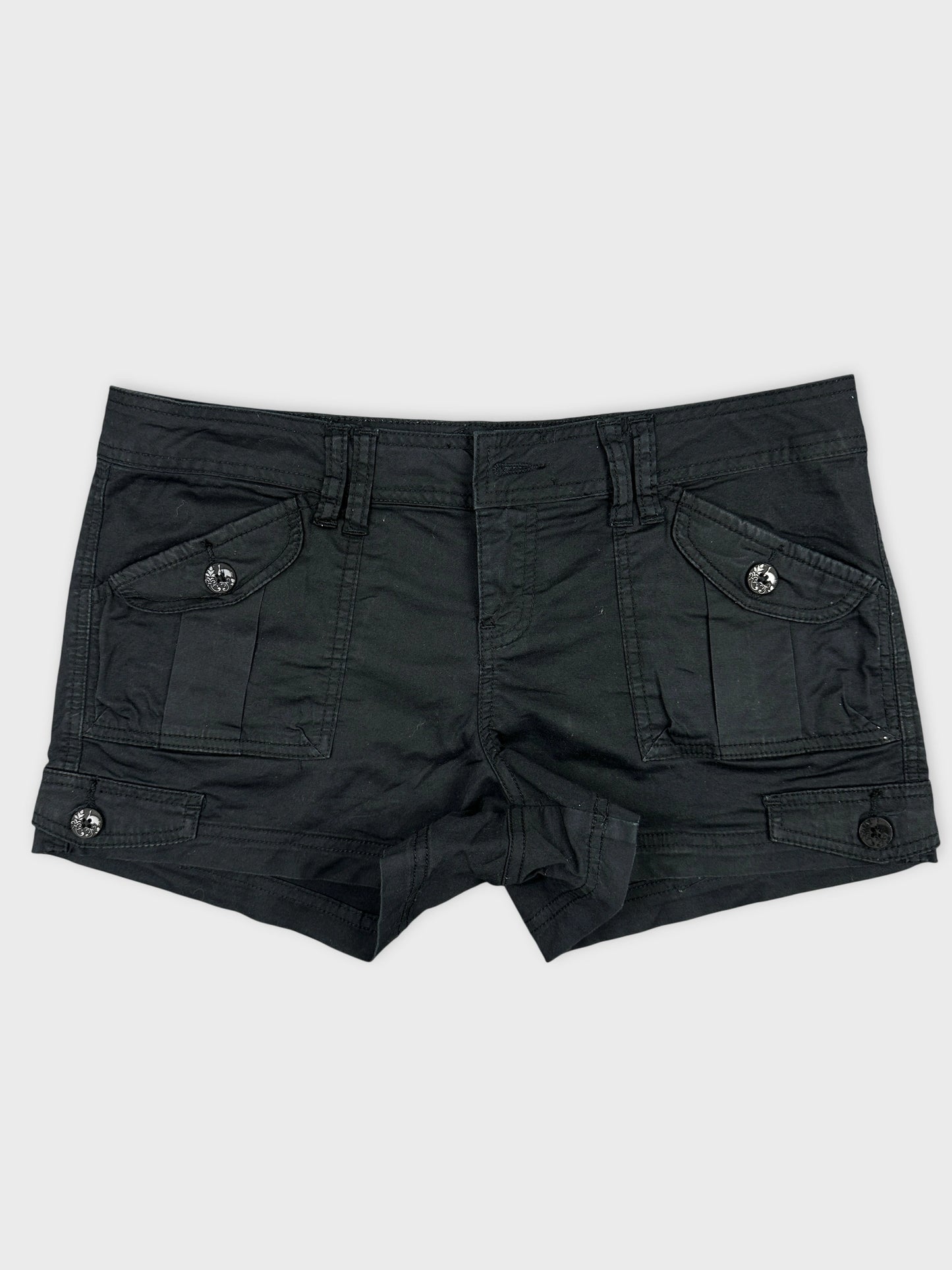 Front view of black denim shorts featuring cargo pockets and button details.