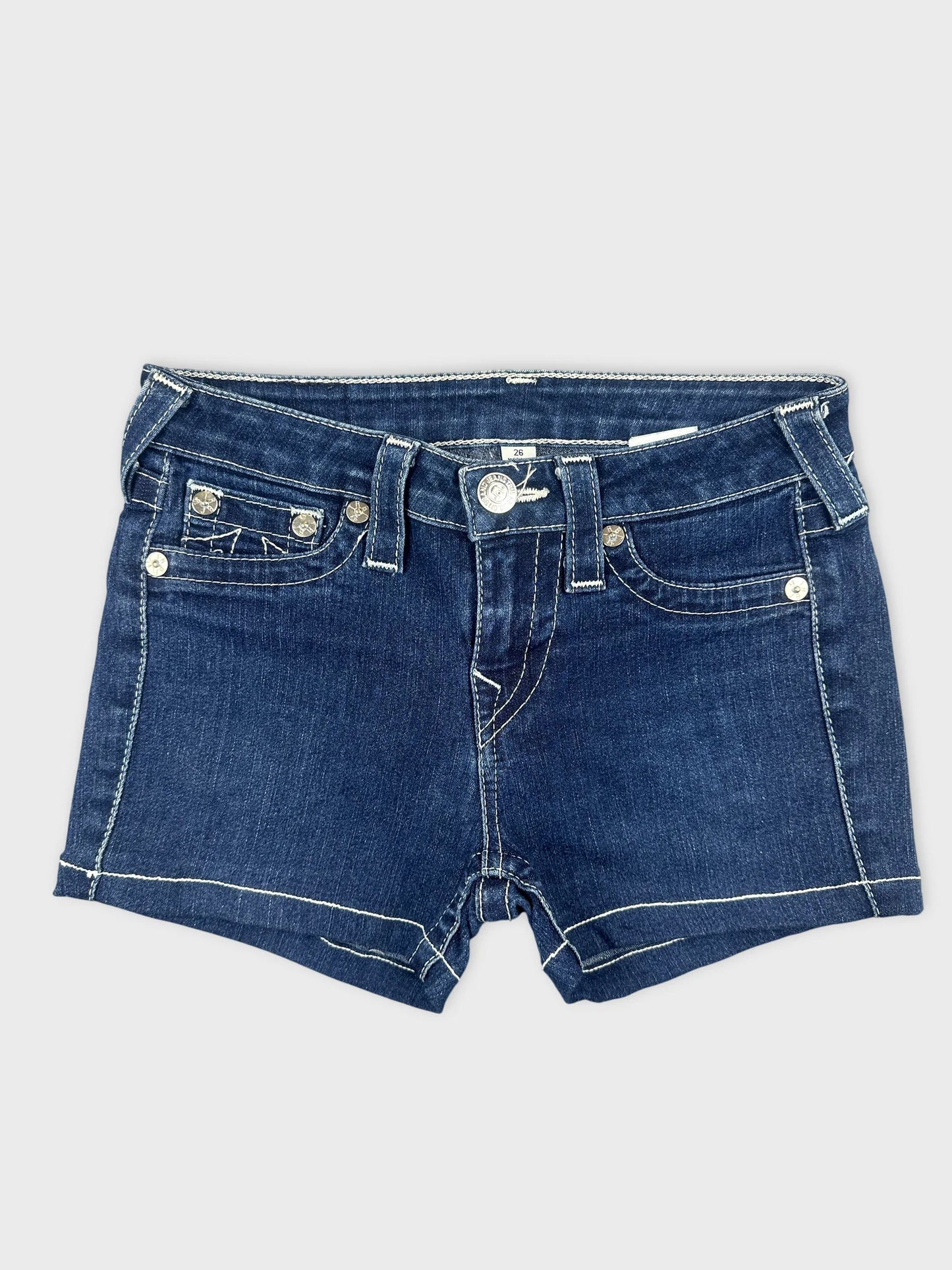 Front view of women's denim shorts in dark blue with white stitching.