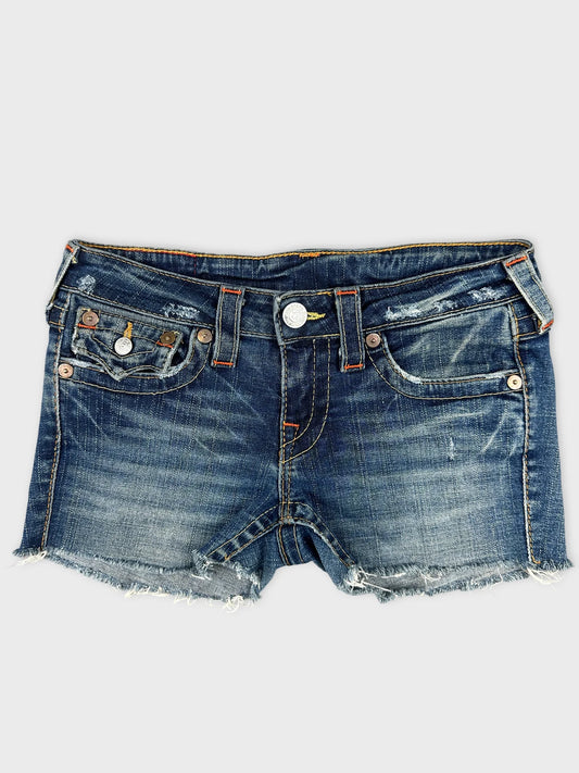 Front view of denim shorts featuring a distressed design and frayed hem.