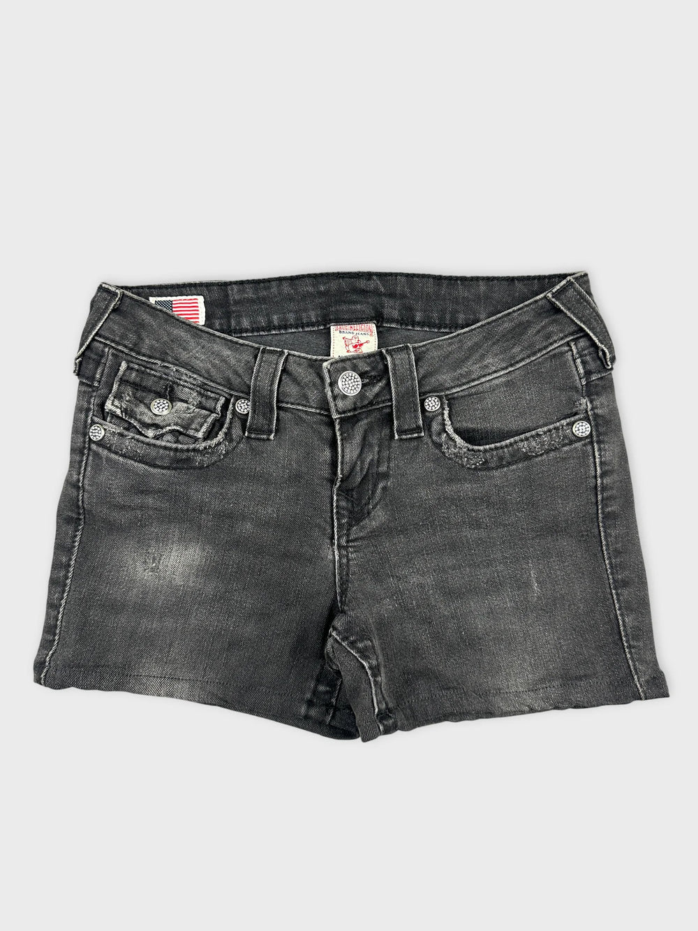 Front view of women's denim shorts in black with distressed detailing.