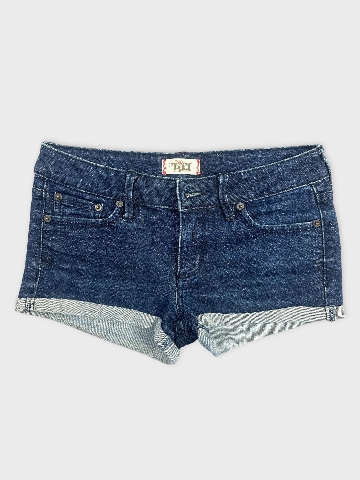 Front view of dark blue denim shorts with a cuffed hem.