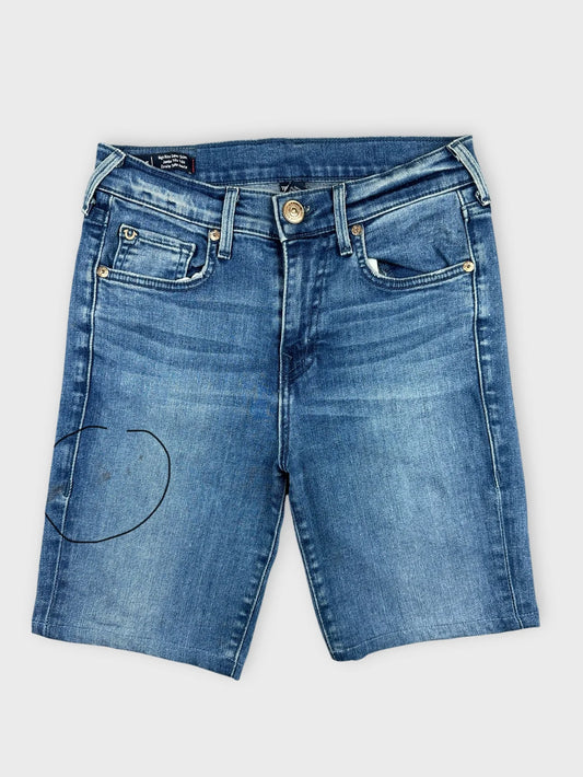 Front view of women denim shorts in a faded blue color with pockets.