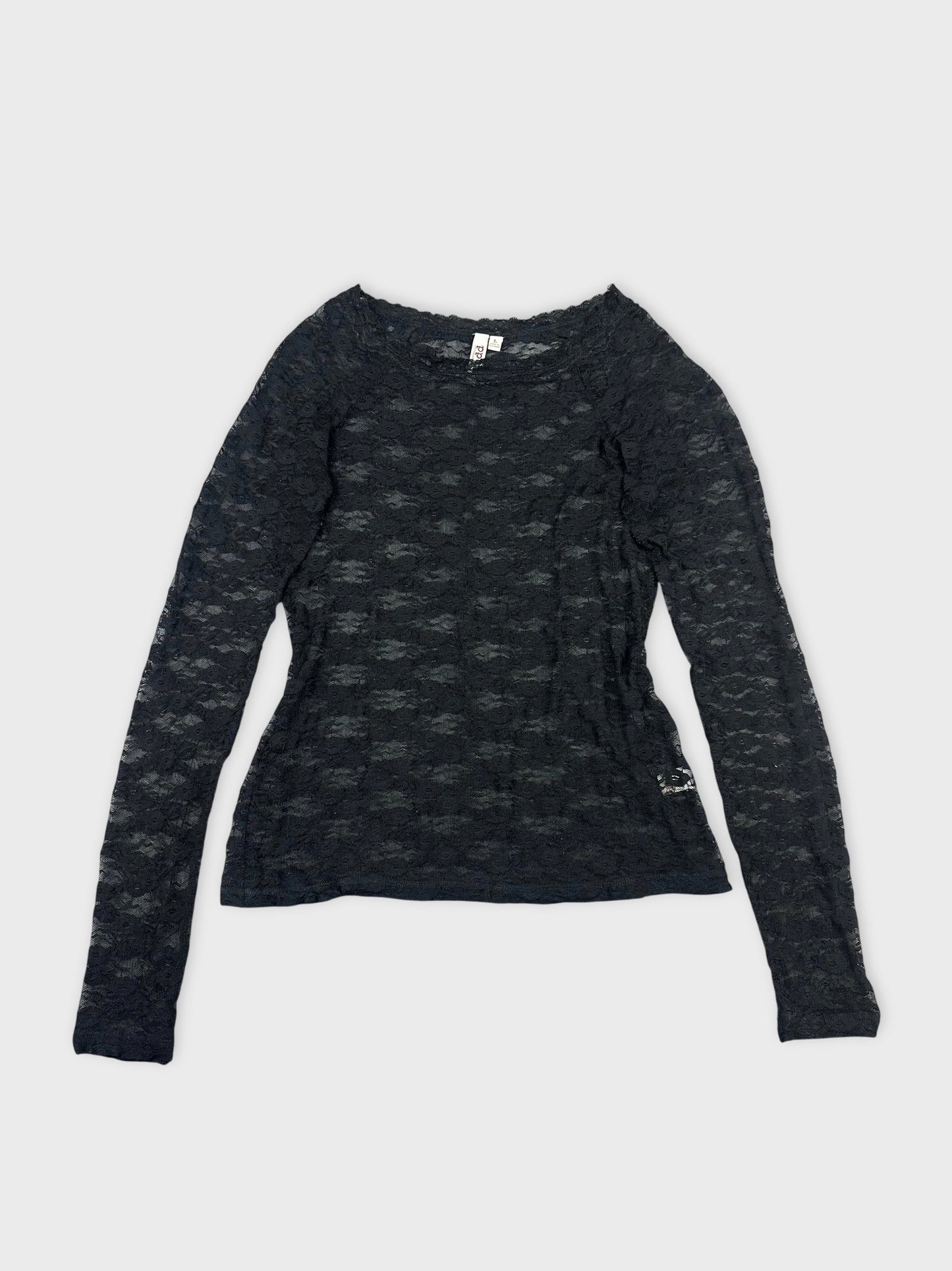 Front view of a black long sleeve blouse featuring a lace pattern.