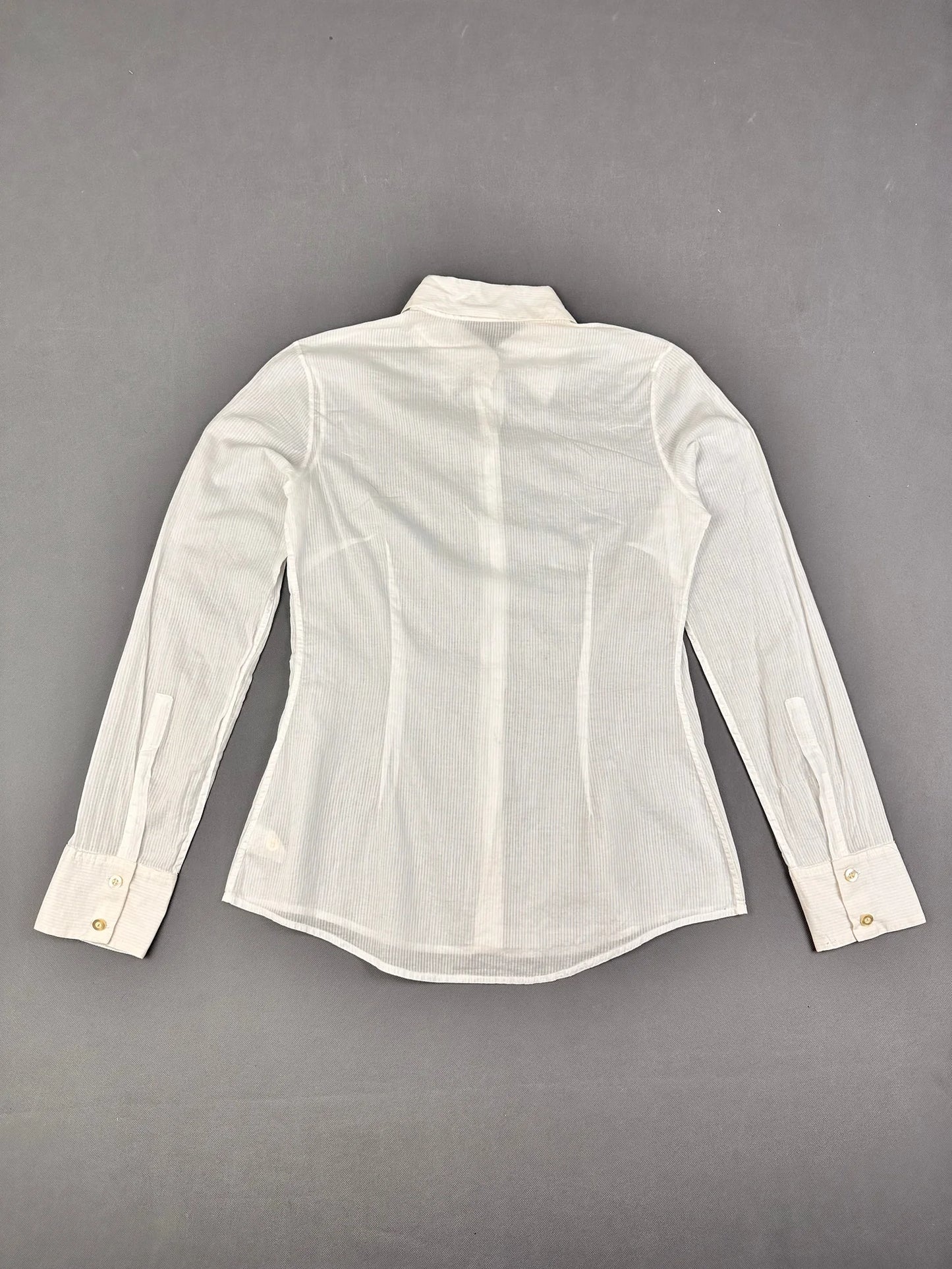 Back view of a white long sleeve button up shirt with vertical stripes.