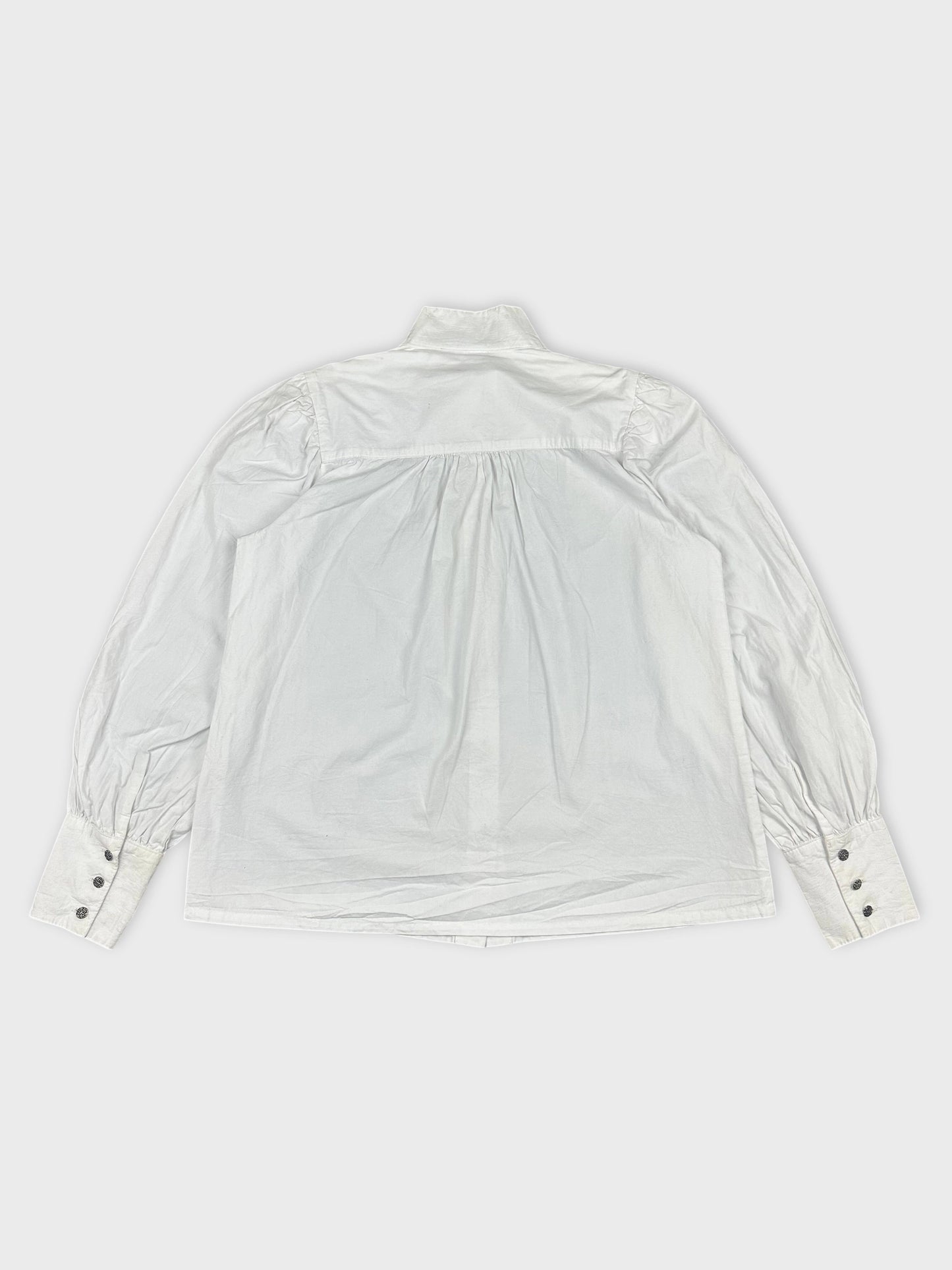 Women long sleeve button up shirt in white back view with gathered detail.