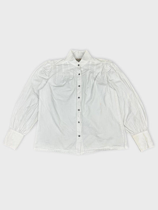 Front view of a white long sleeve button-up shirt with pleated shoulders.