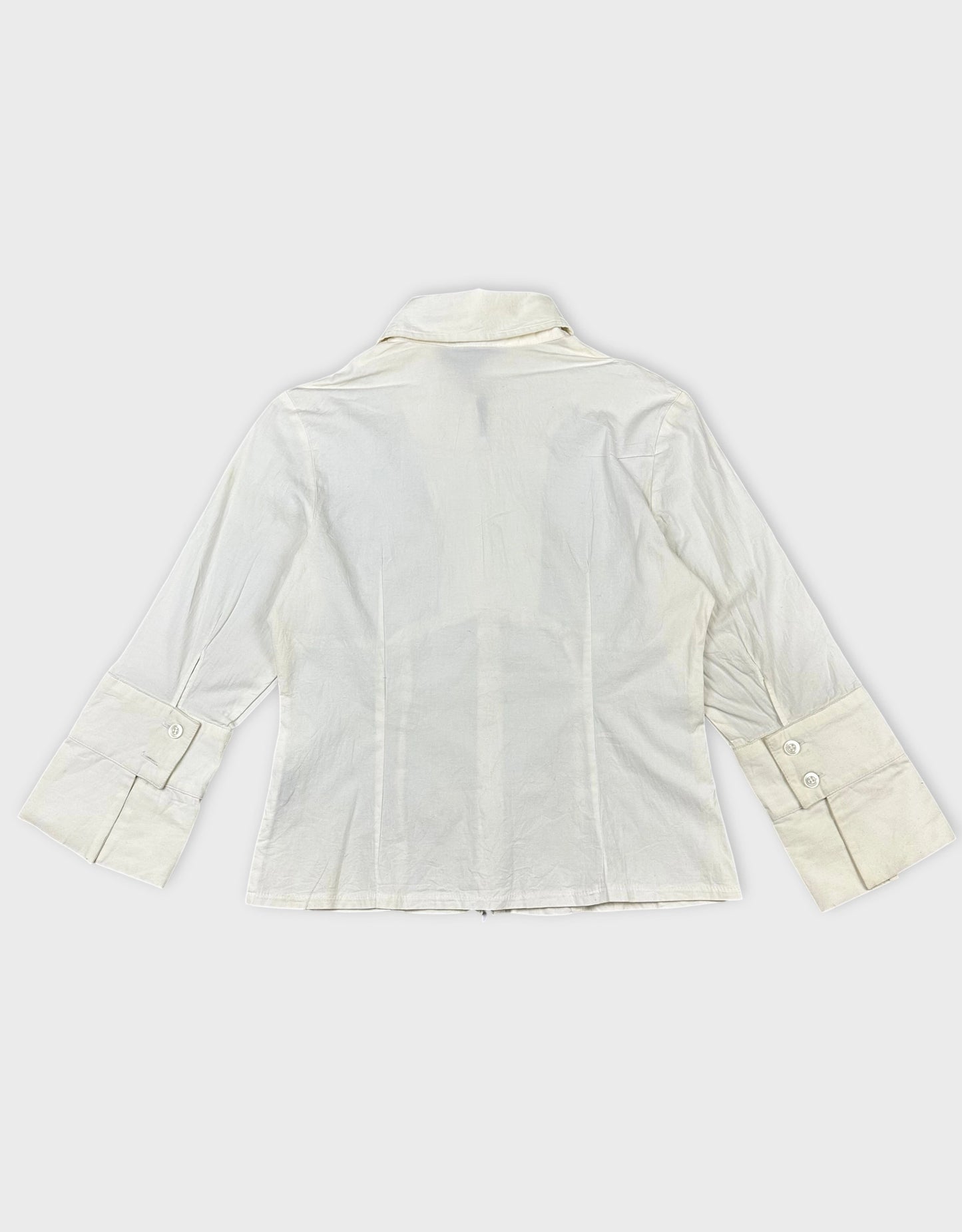 Back view of a women's long sleeve shirt in cream with wide cuffs.