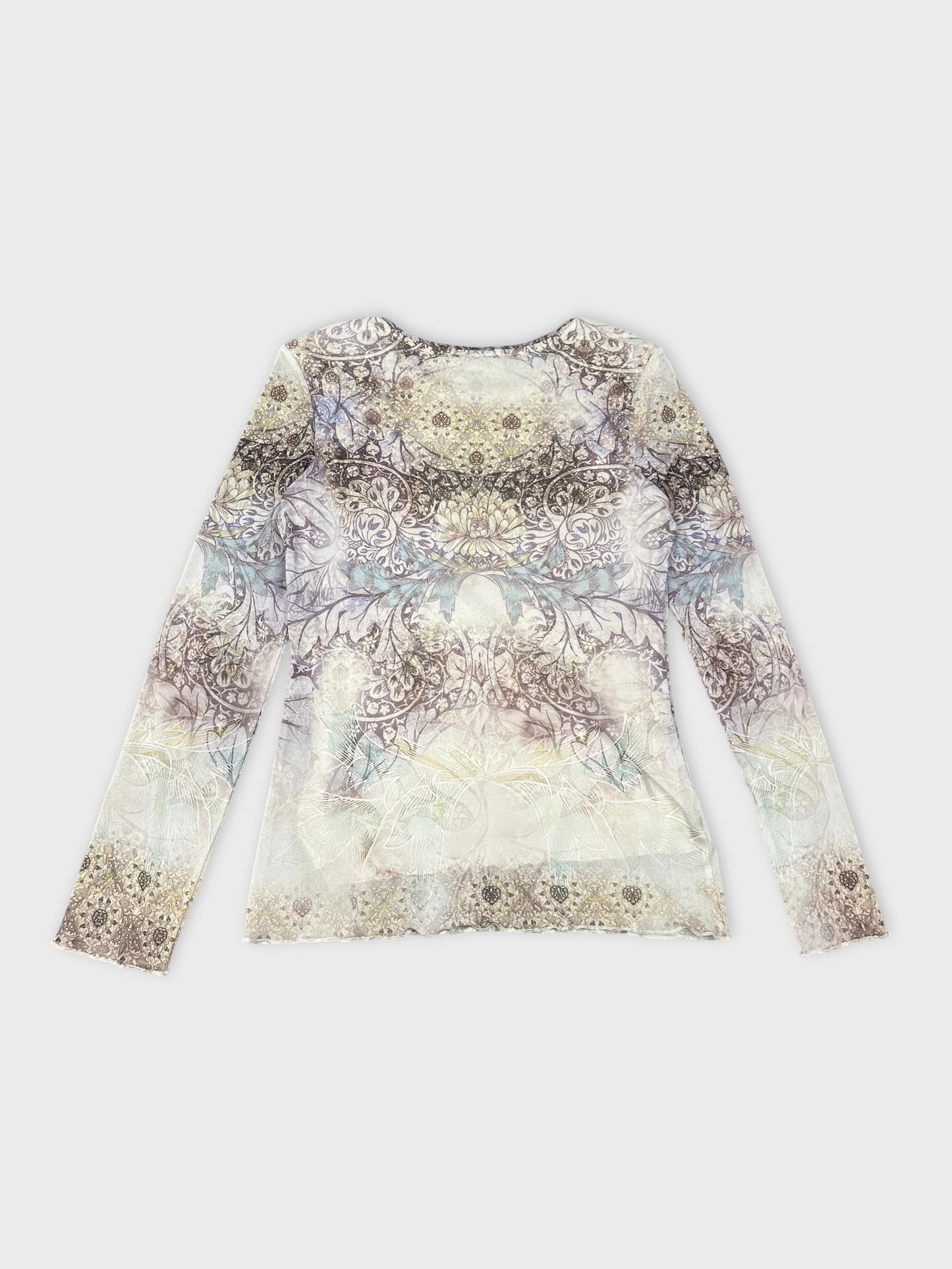 Back view of a long sleeve shirt in pastel floral pattern.