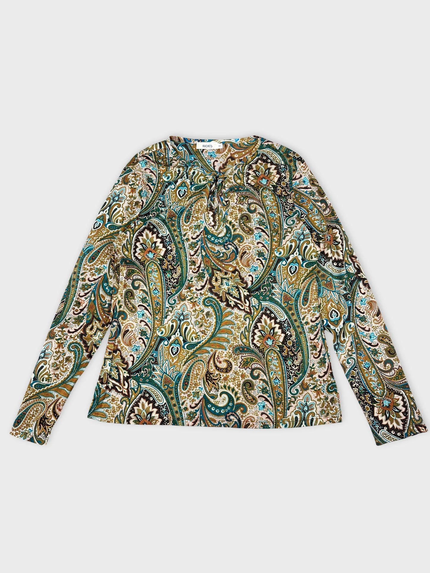 Front view of a long sleeve shirt in green paisley print.