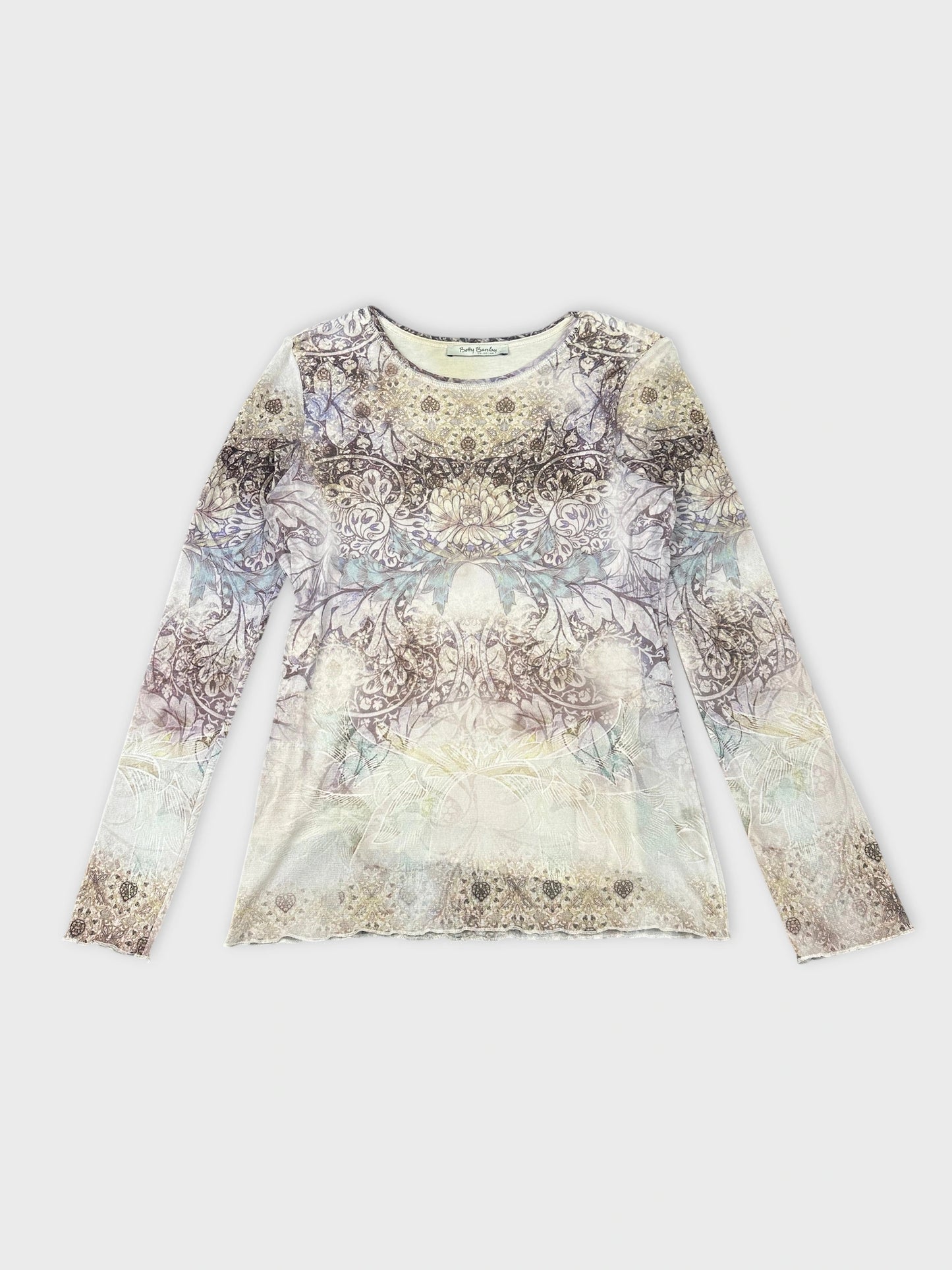Front view of a long sleeve shirt in pastel hues with intricate floral print.