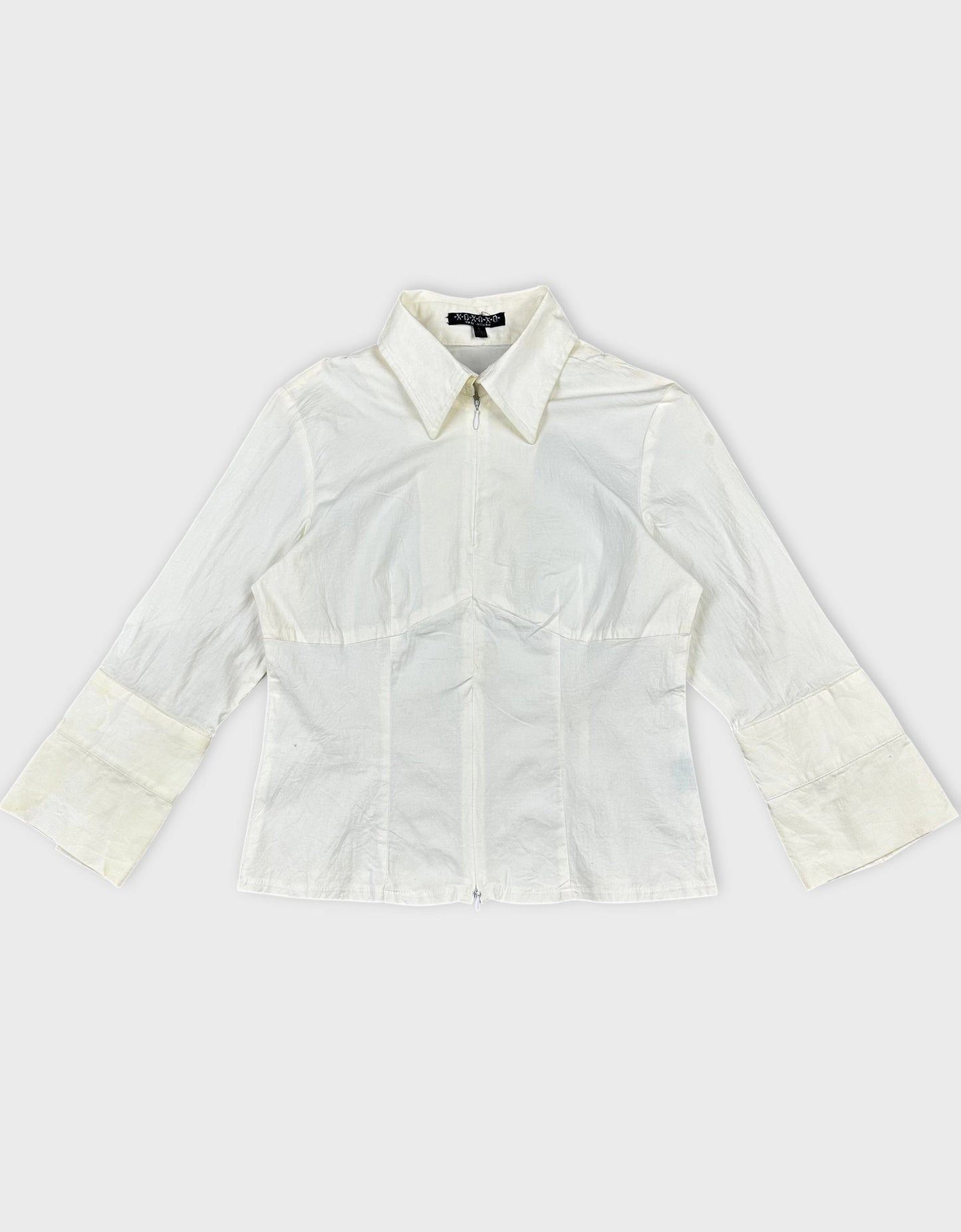 Front view of a white long sleeve shirt with a zip detail.