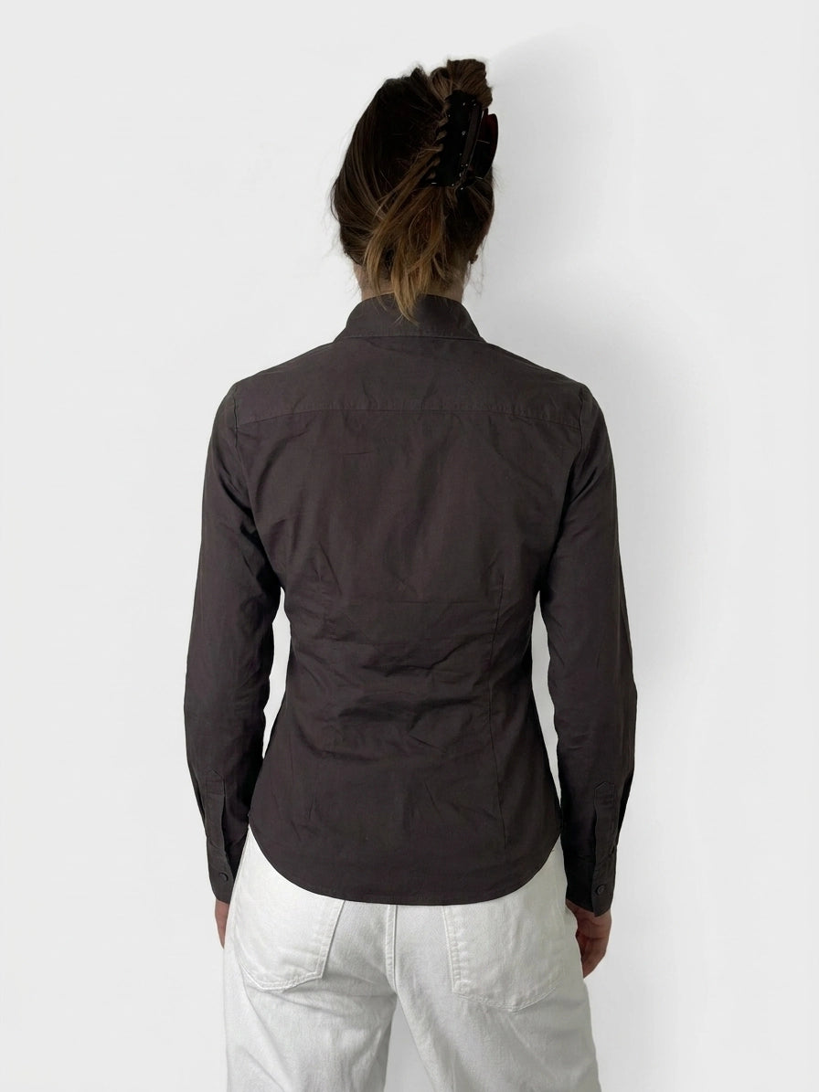 Back view of a long sleeve shirt in dark brown with a classic collar.