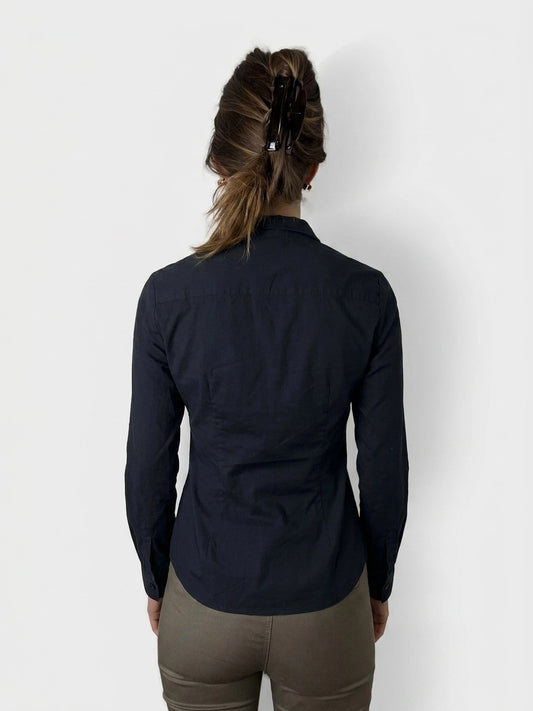 Back view of a navy long sleeve shirt featuring a classic collar.