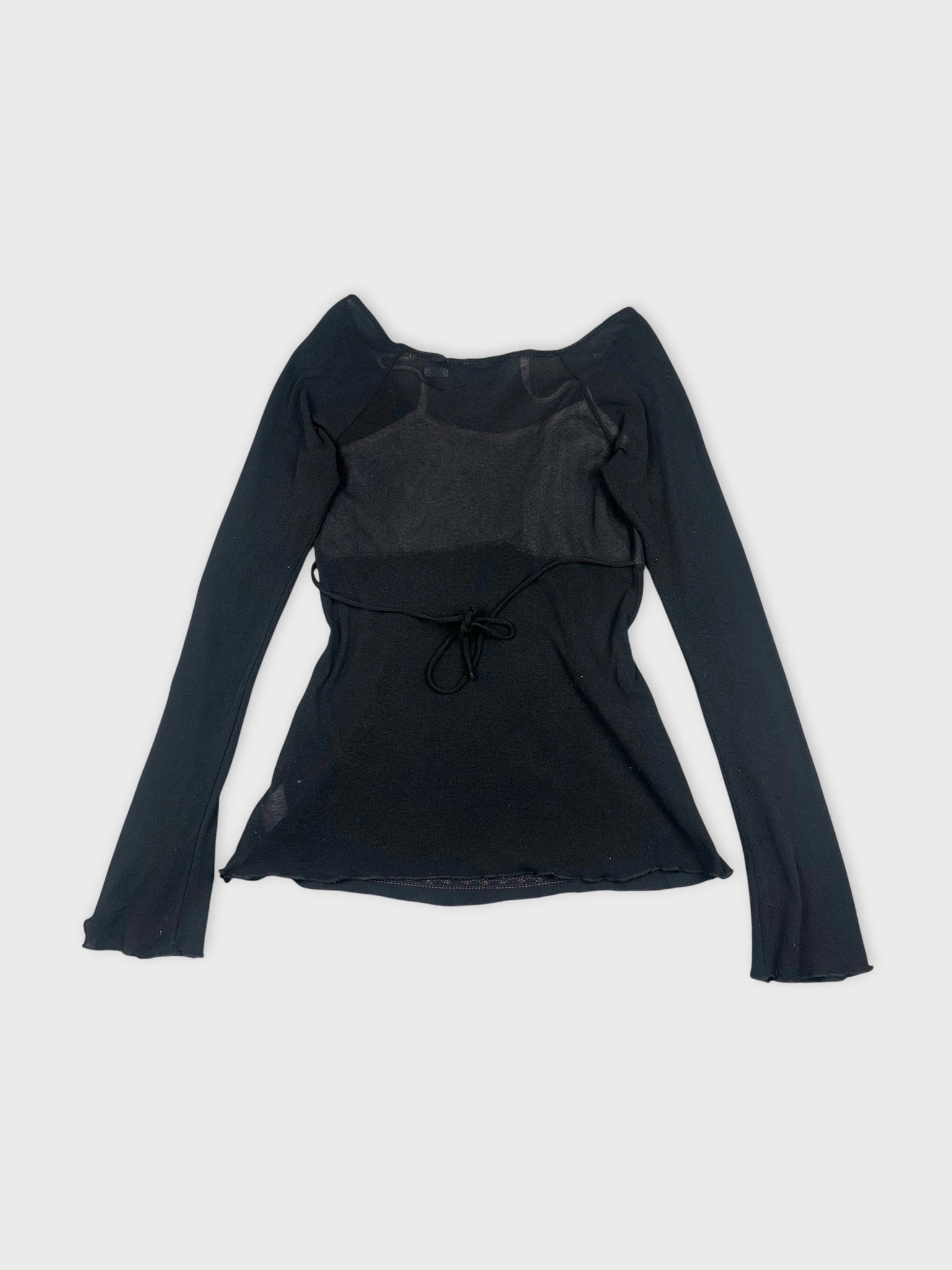 Back view of a black long sleeve top featuring a tie detail.