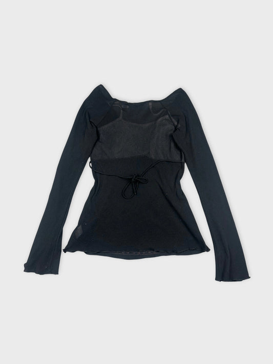Back view of a black long sleeve top featuring a tie detail.