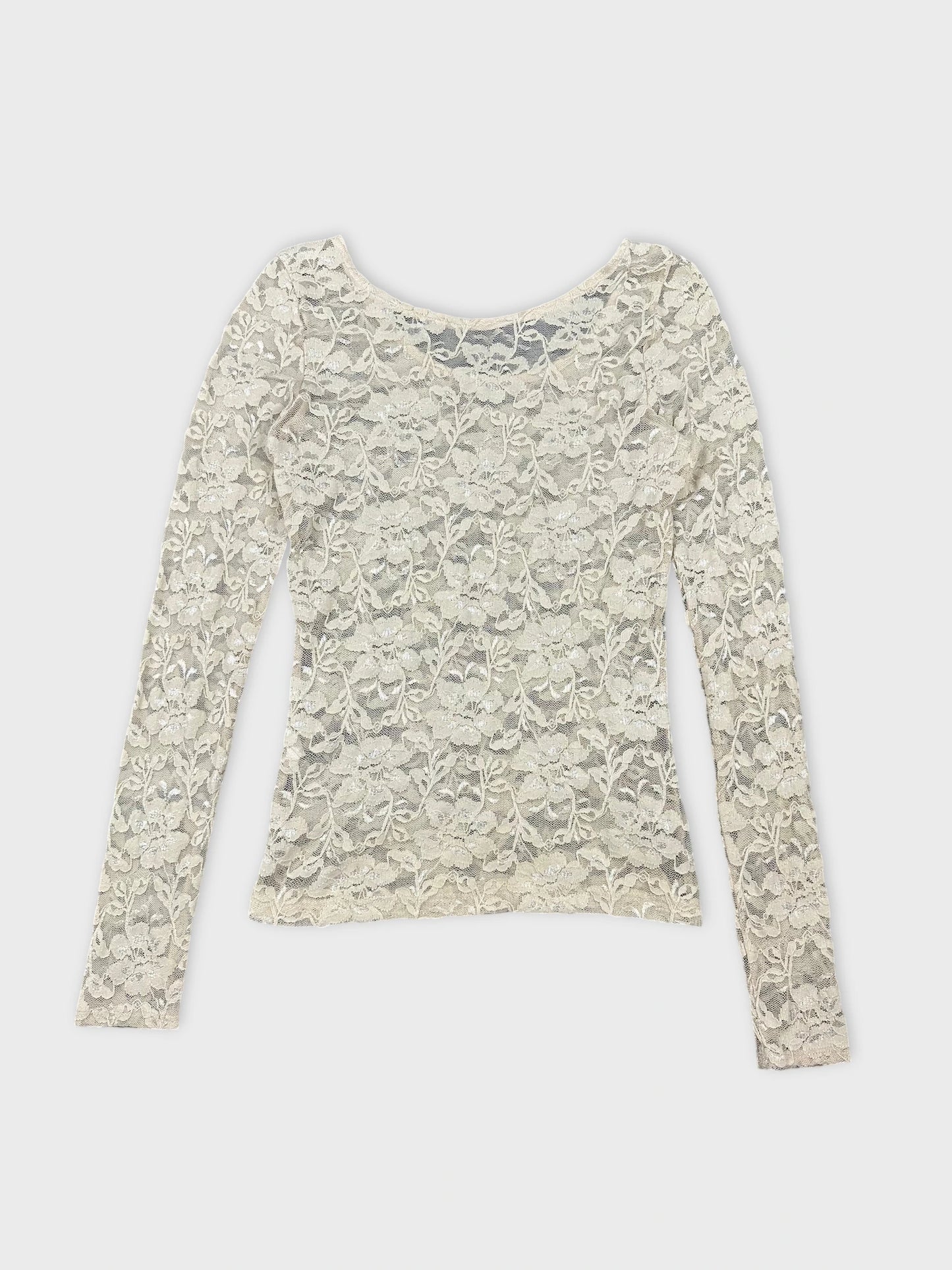Back view of a long sleeve cream lace top with floral pattern.