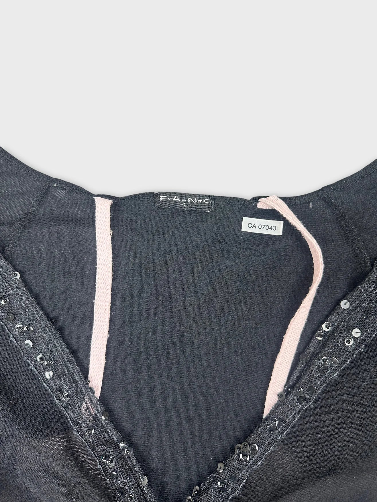 Long sleeve top in black with lace trim detail view