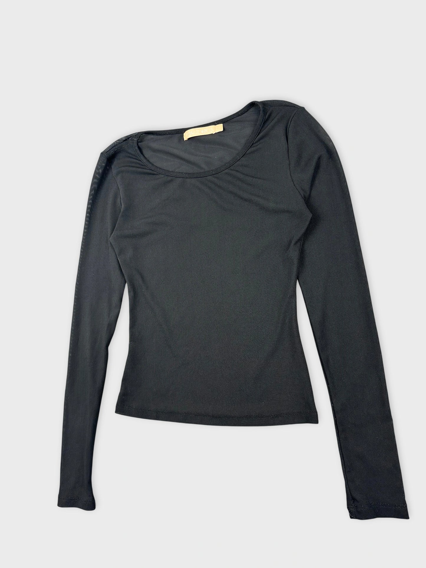 Detail view of a long sleeve top in black with a round neckline.