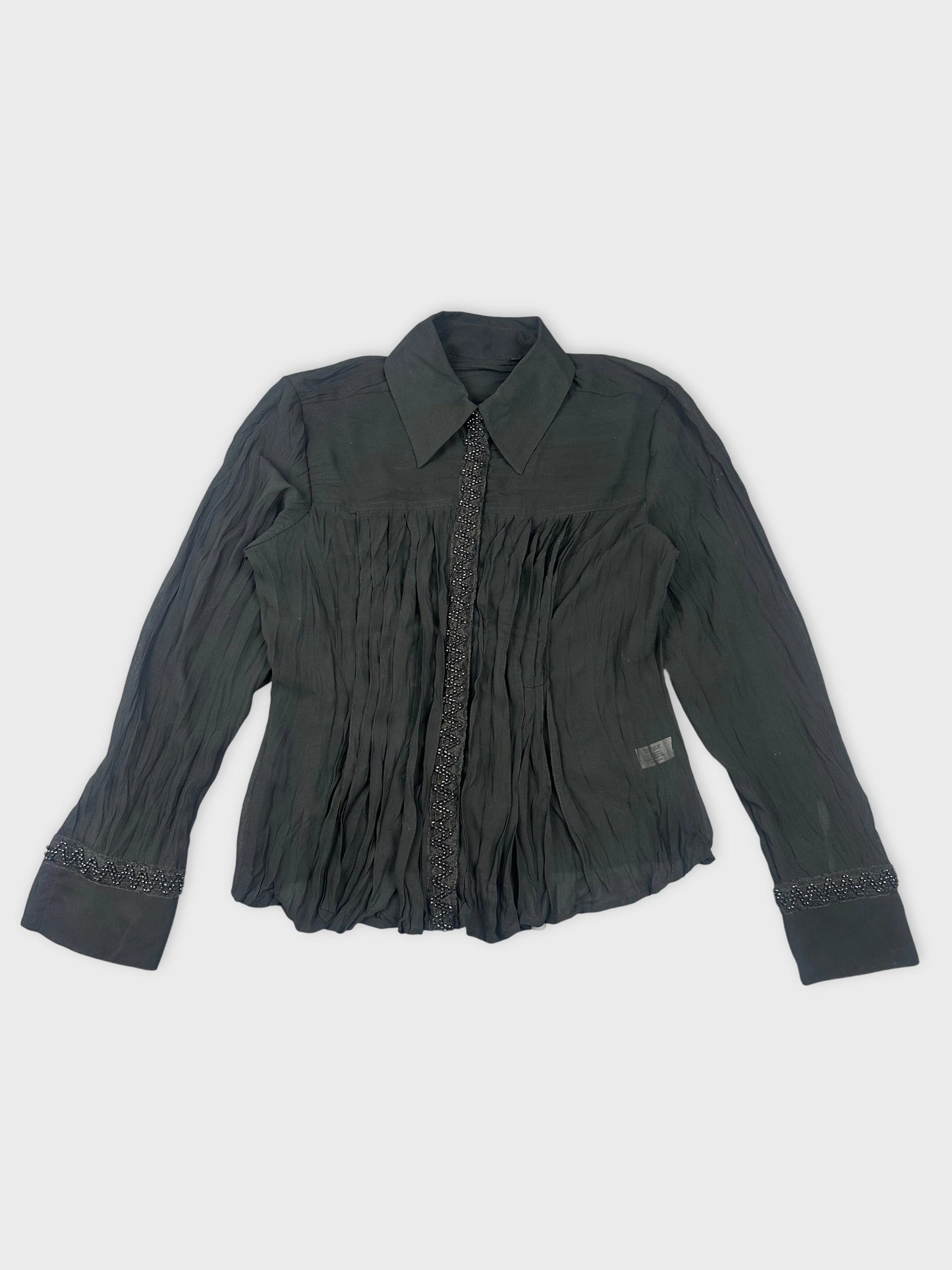 Black long sleeve top with pleated detail front view.