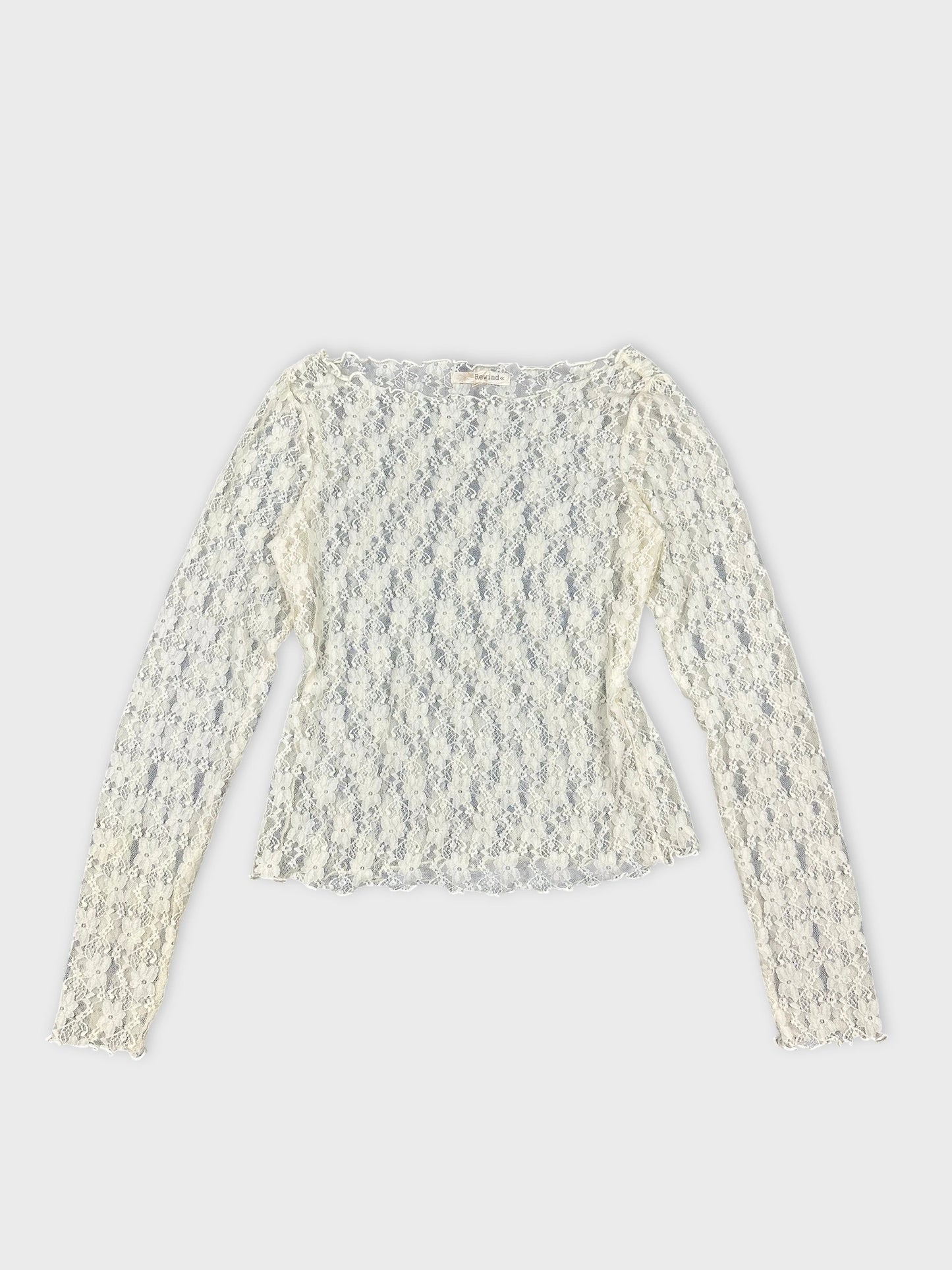 Women's long sleeve top in off-white with lace detail front view.