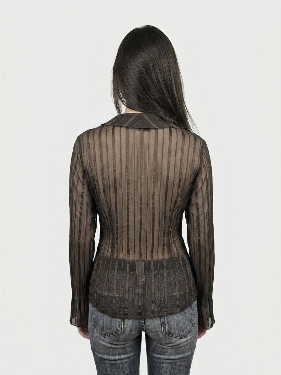 Long sleeve top in black, with ribbed texture, back view.