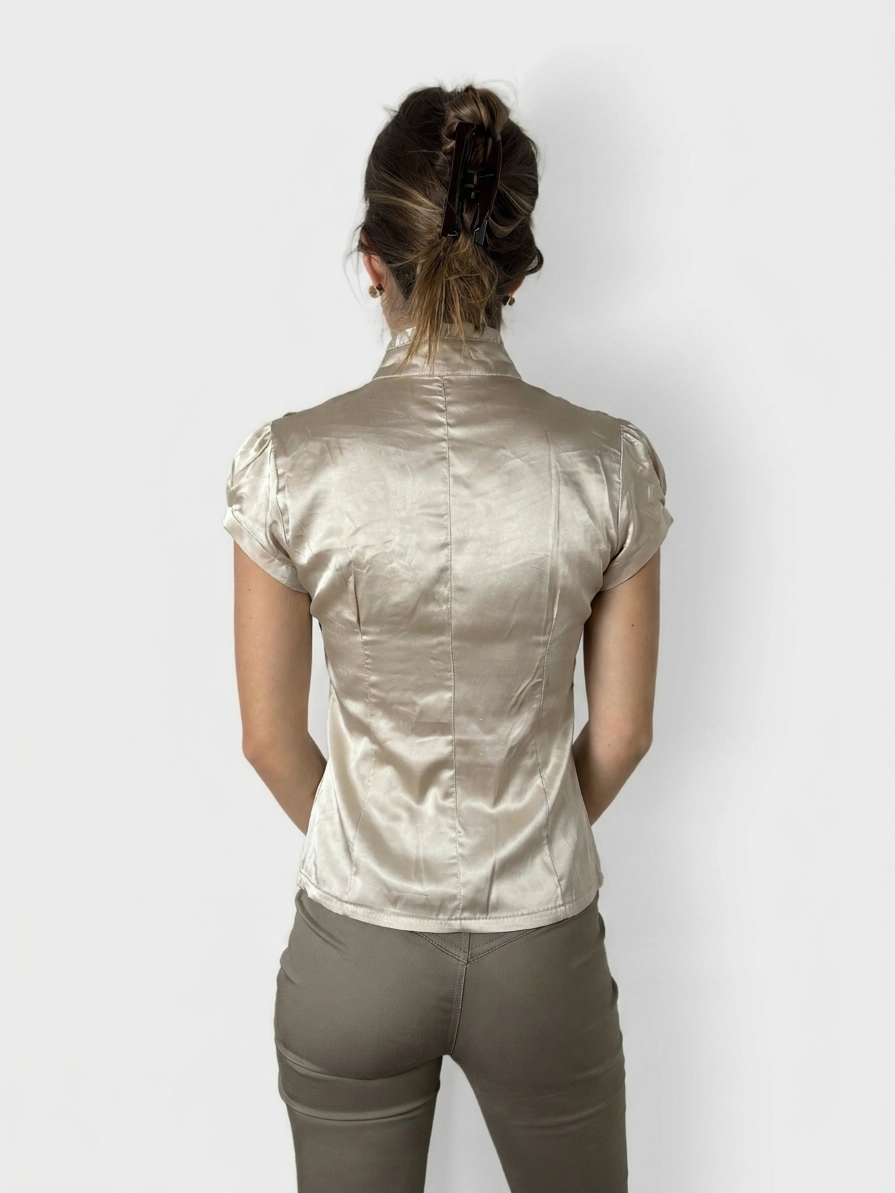 Back view of a short sleeve button-up shirt in beige with a fitted shape.