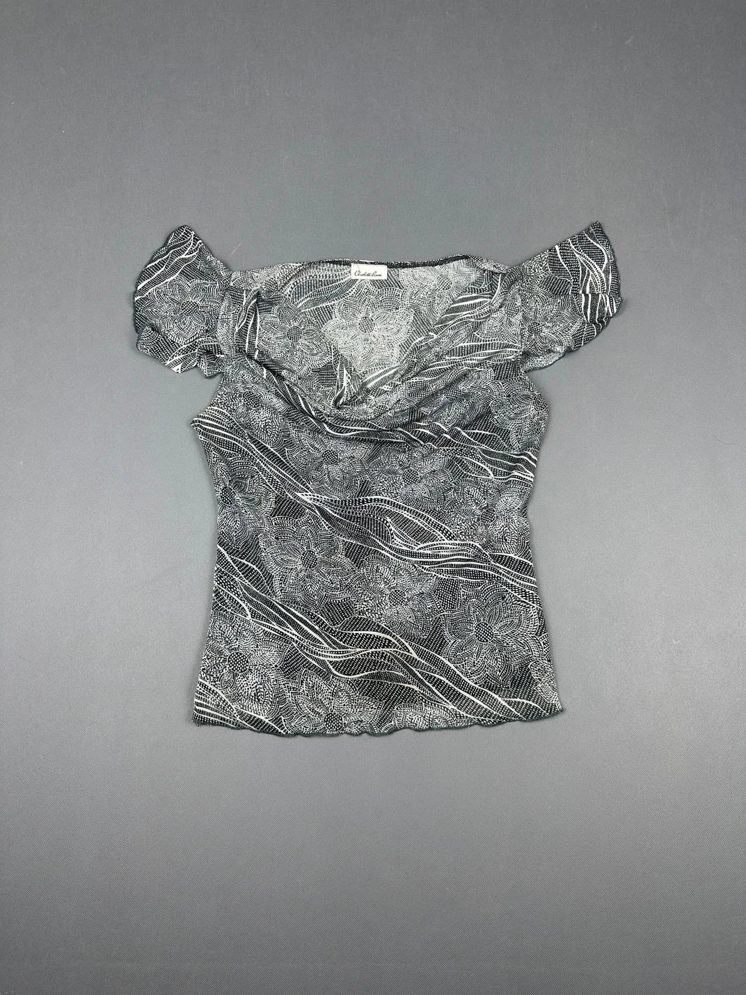 Short sleeve top in black with floral pattern front view