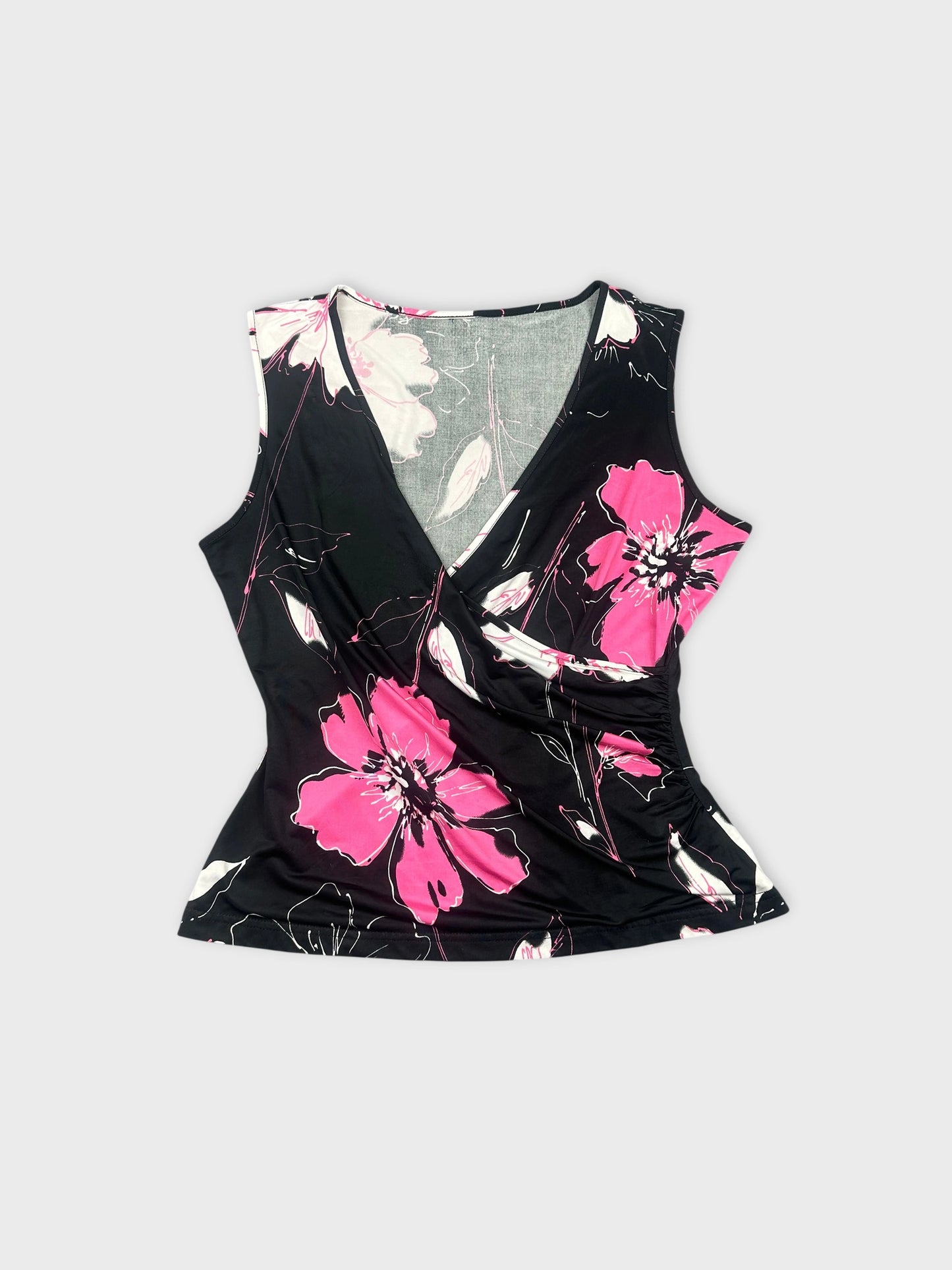 Front view of a black floral sleeveless top with pink flowers.