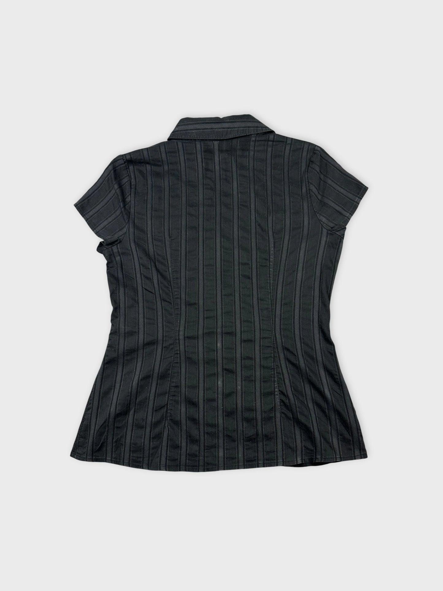 Back view of a black short sleeve shirt with vertical stripes.