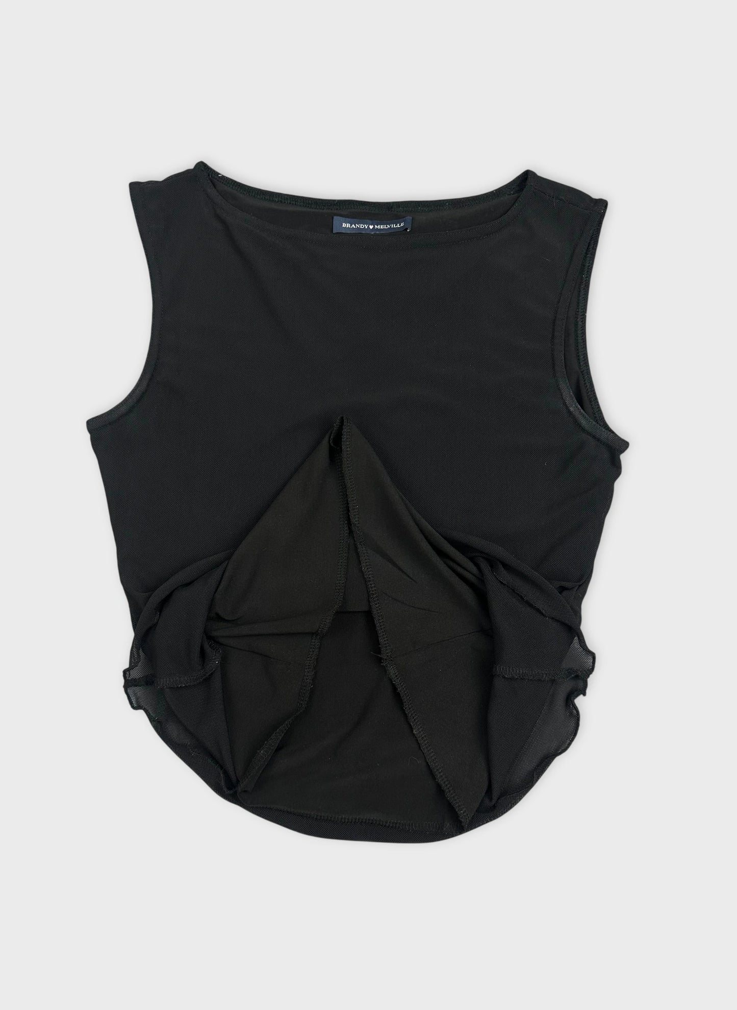 Detail view of a black sleeveless top featuring a layered design.